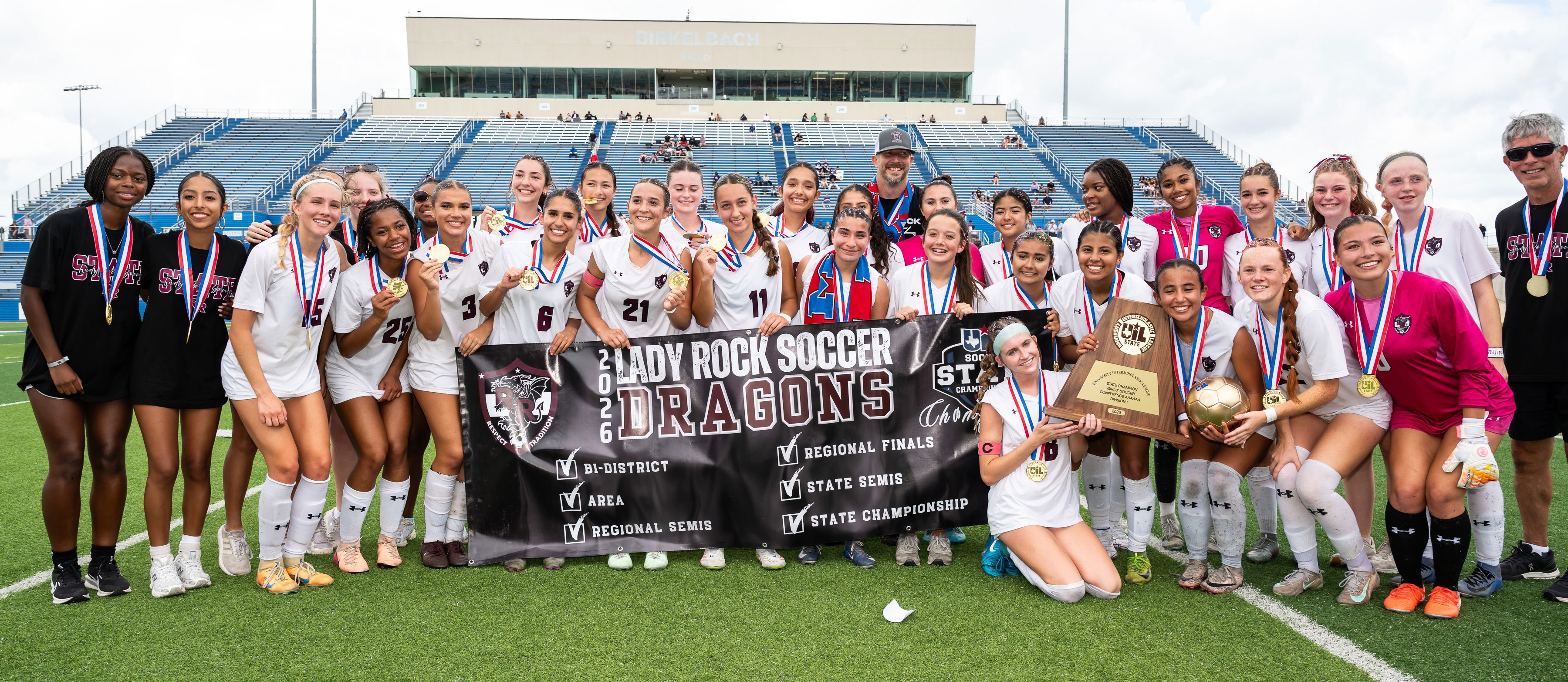 Round Rock High School soccer team with state championship trophy