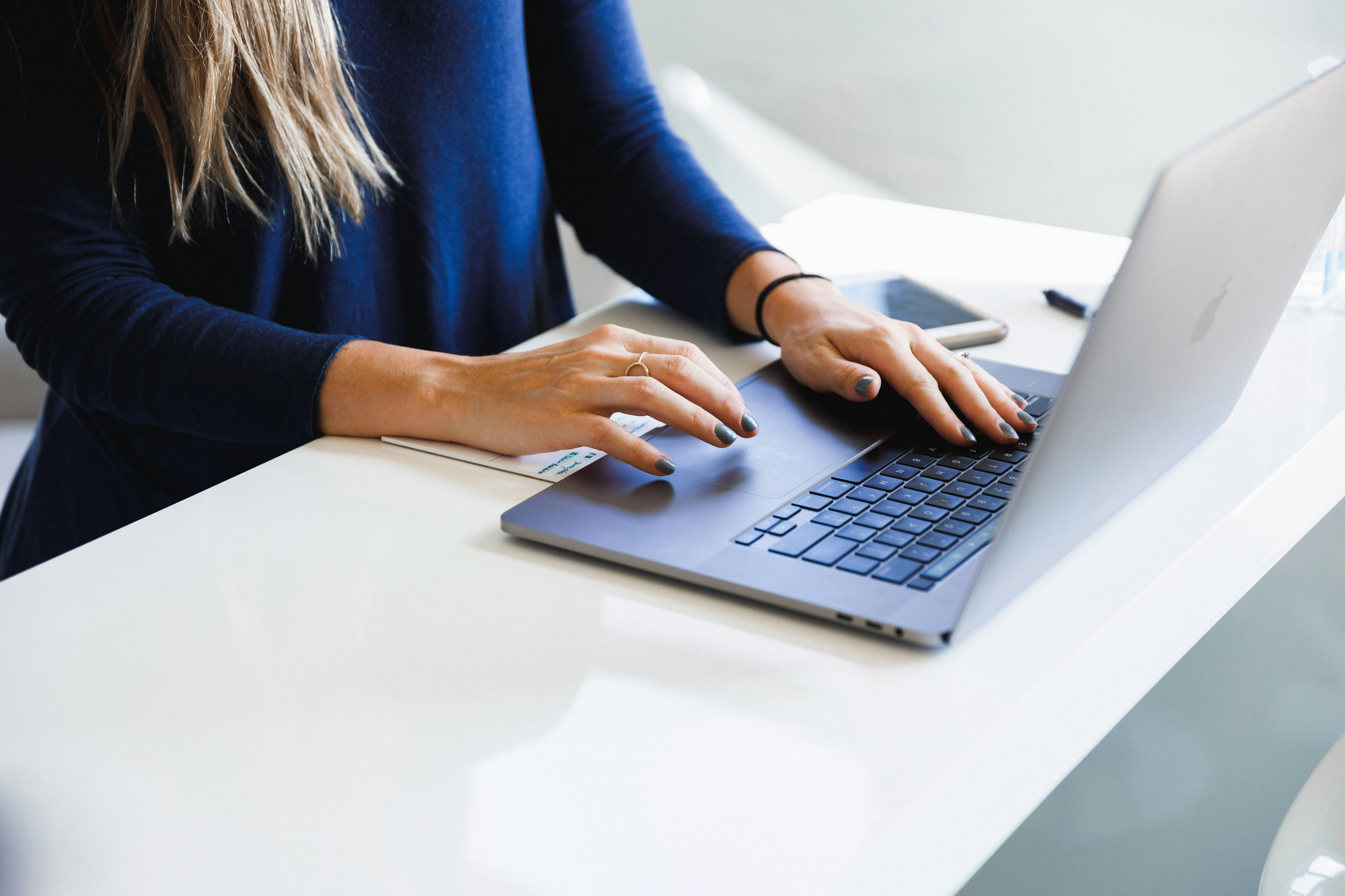 Typing on a laptop