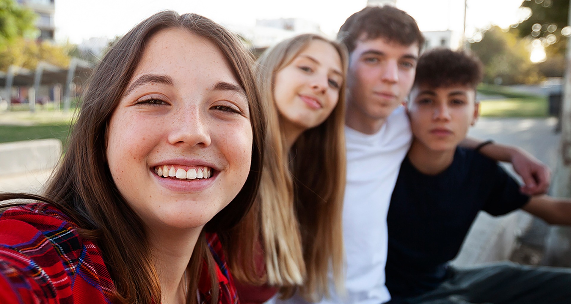 Four students smile for the camera