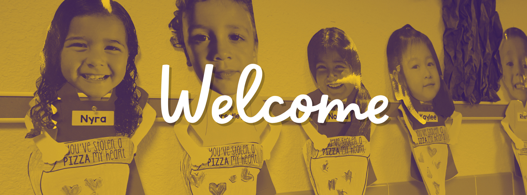 A bulletin board display featuring cutouts of students’ faces attached to paper aprons with the phrase 'You’ve stolen a PIZZA my heart' written on them. The word 'Welcome' is overlaid in large, white cursive text. The image has a yellow and purple color filter, matching Wylie ISD's school colors. The background shows a classroom wall with additional student projects and decorations.