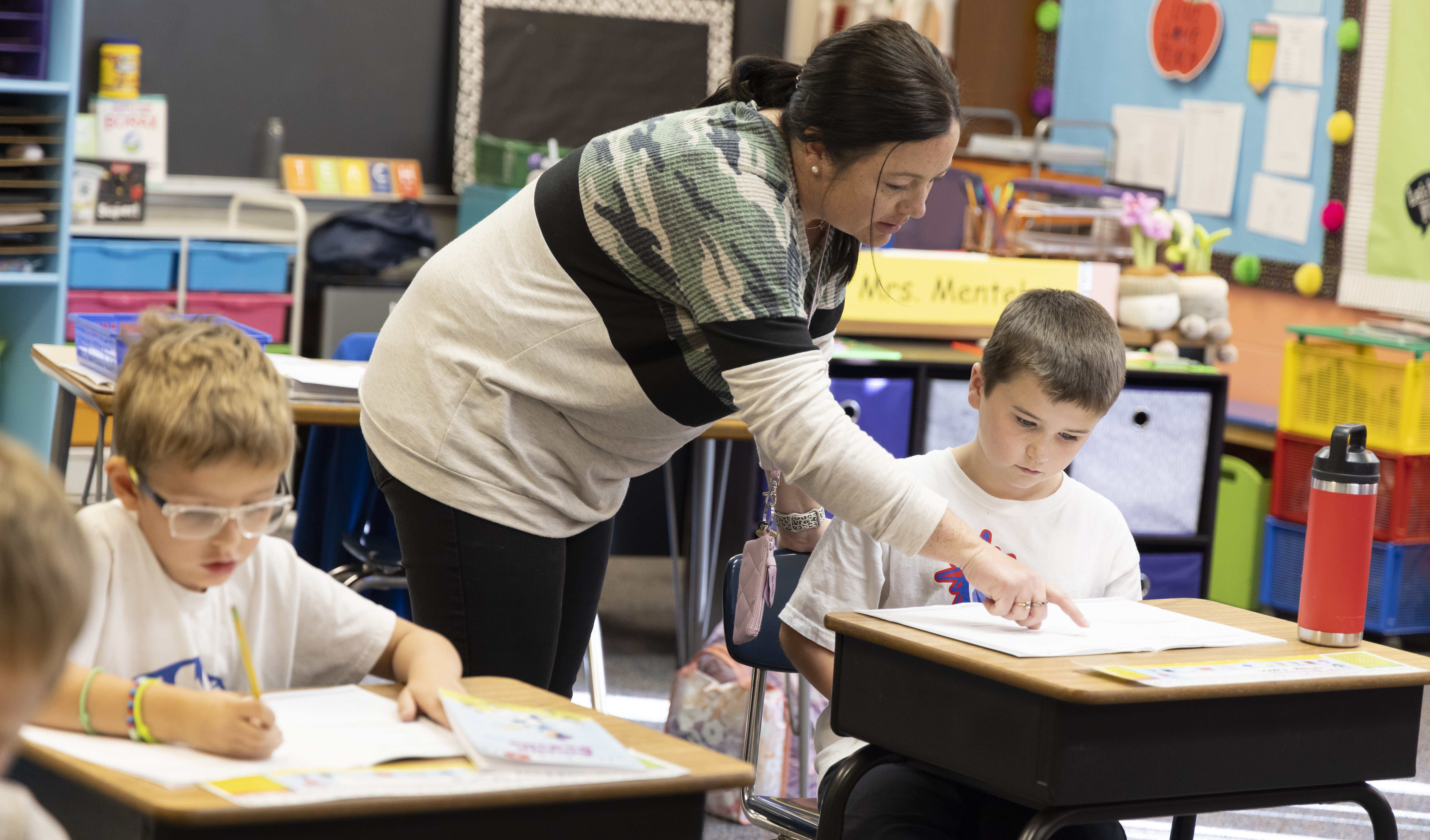 Mrs. Mentele helping students