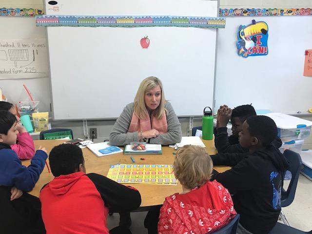 teacher talking to her students