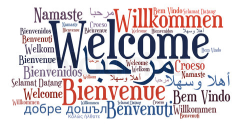 1. A diverse word cloud displaying the word "welcome" in various languages, symbolizing global hospitality and inclusivity.