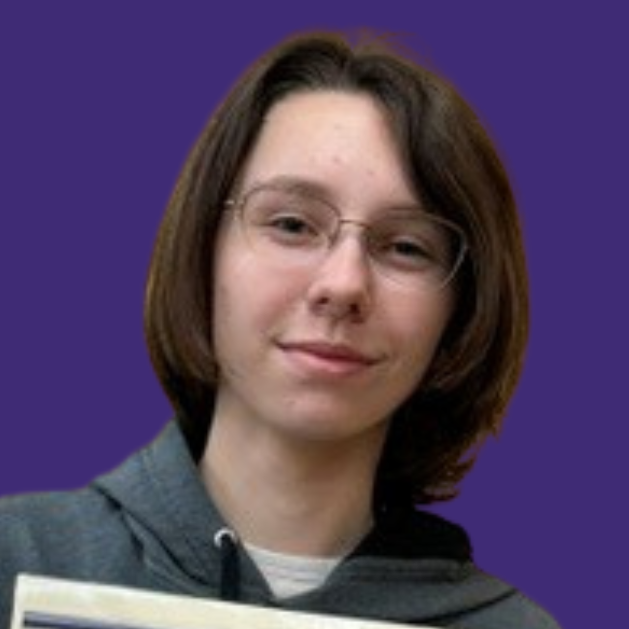 Person with short hair and glasses holds a certificate with a blue logo and text.