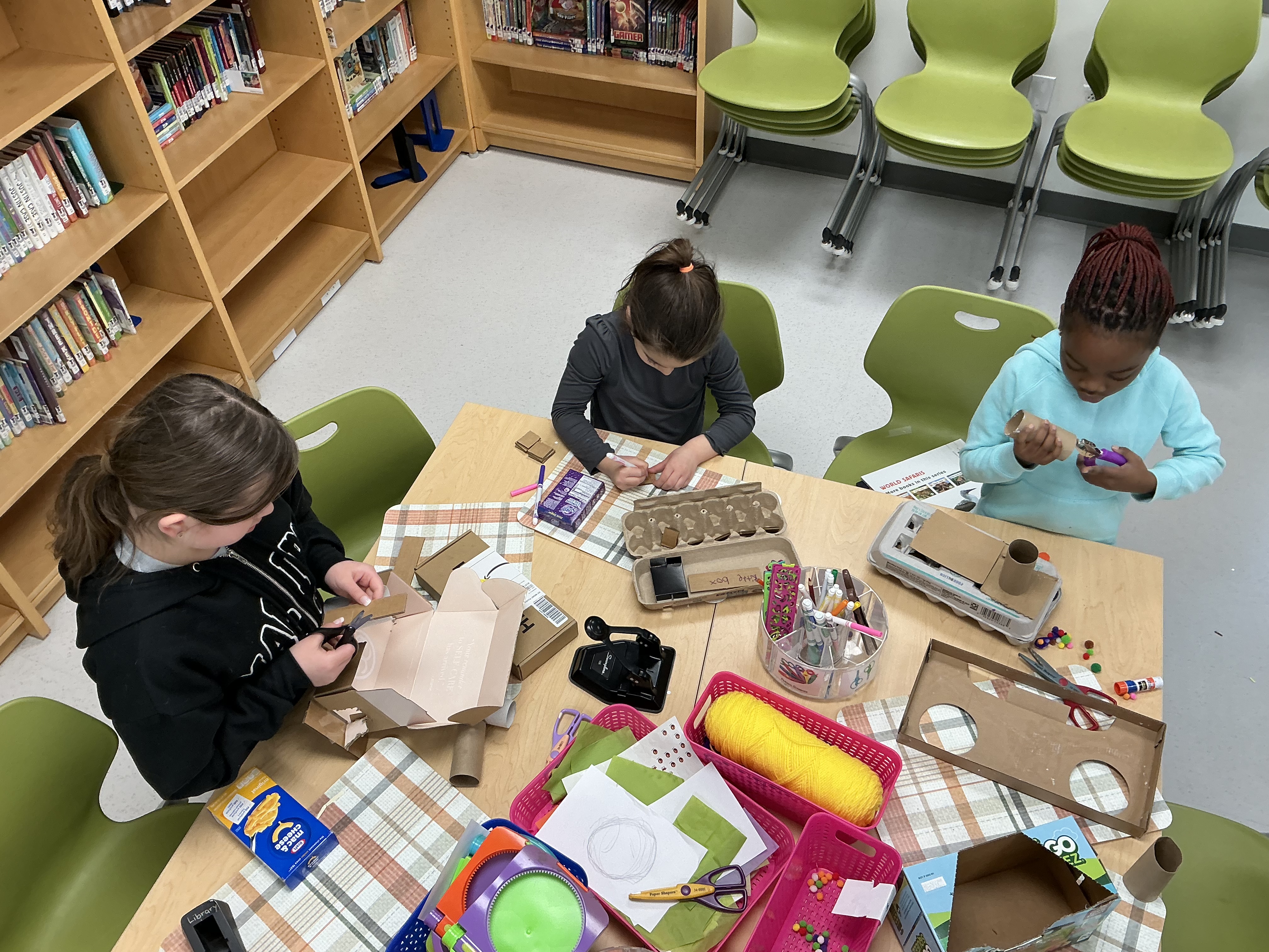 students building with cardboard