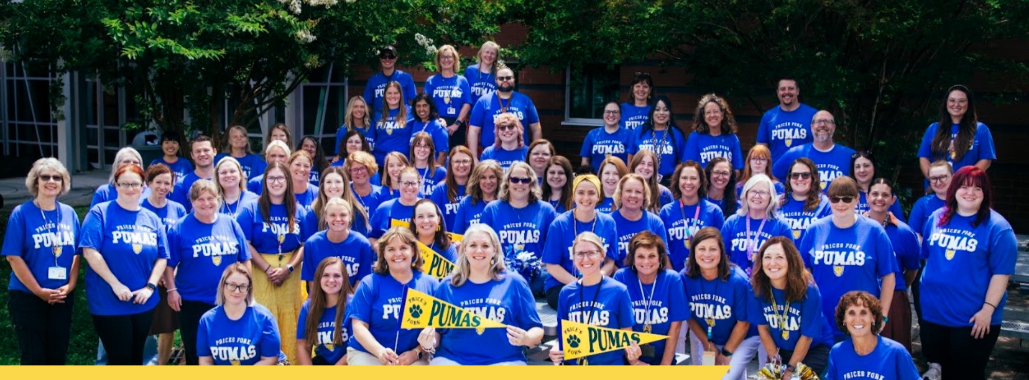 a picture of the PFES staff wearing matching blue Prices Fork PUMAS shirts