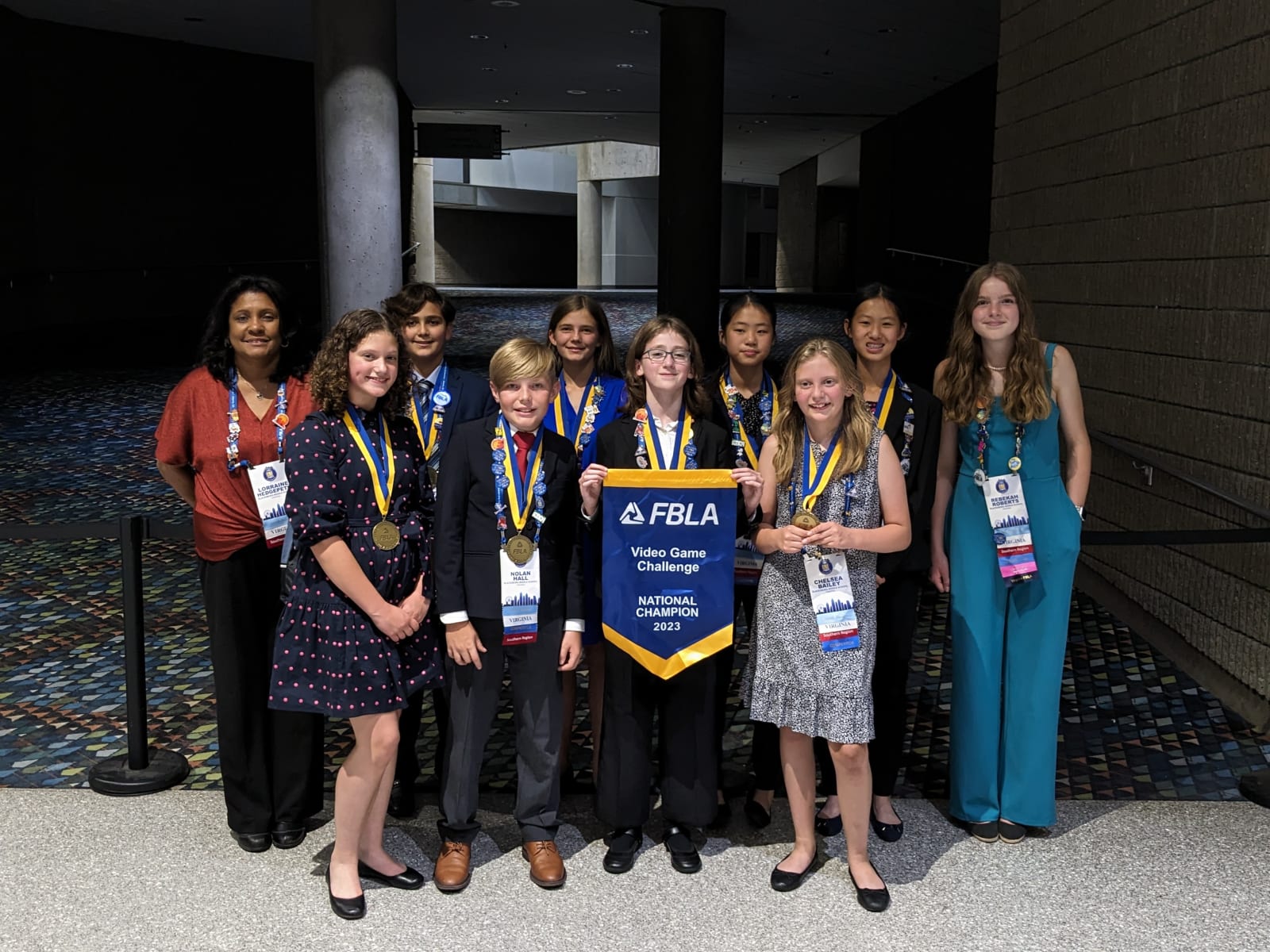 fbla middle school students with medals