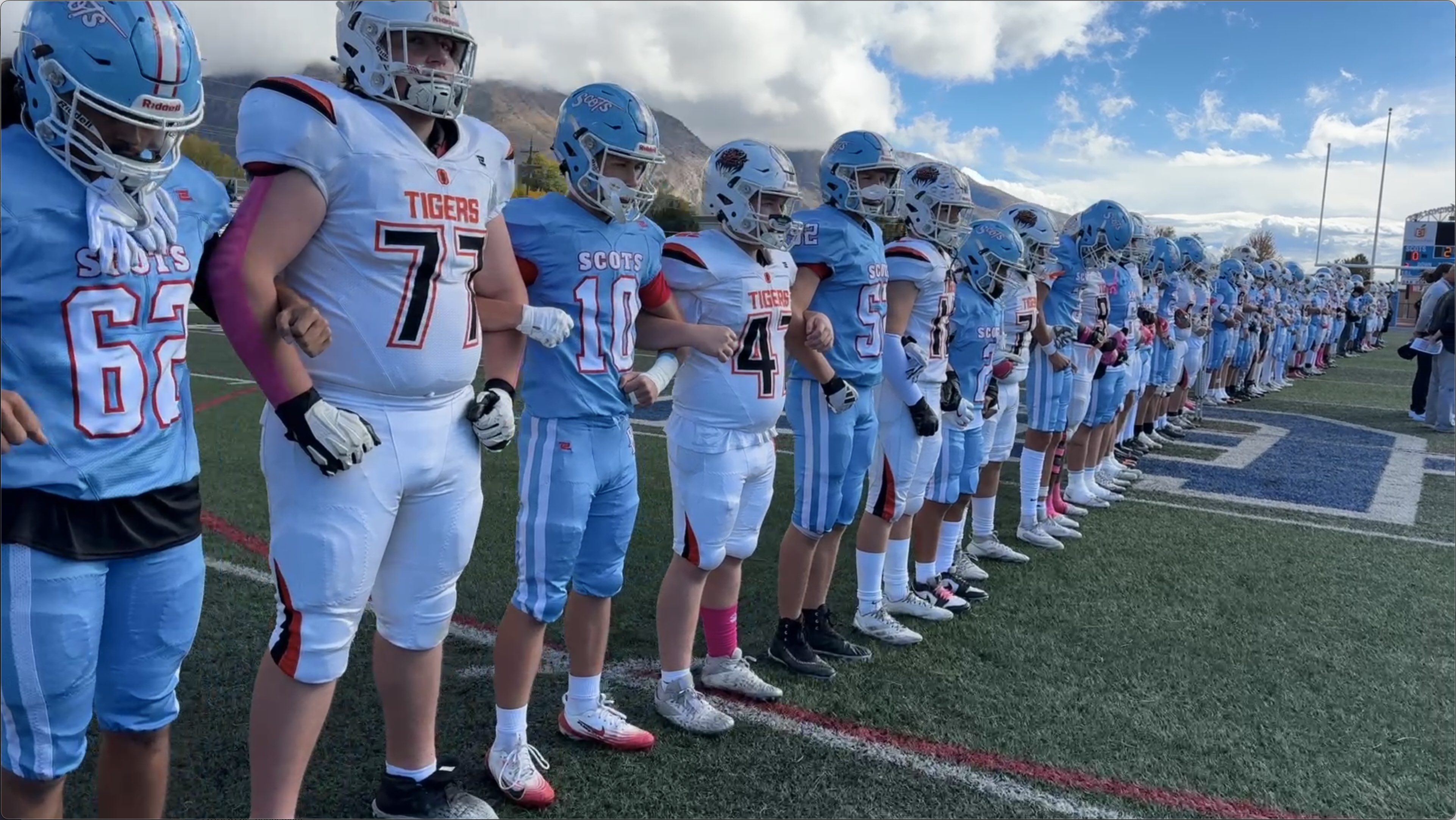 Ben Lomond and Ogden High football players standing together