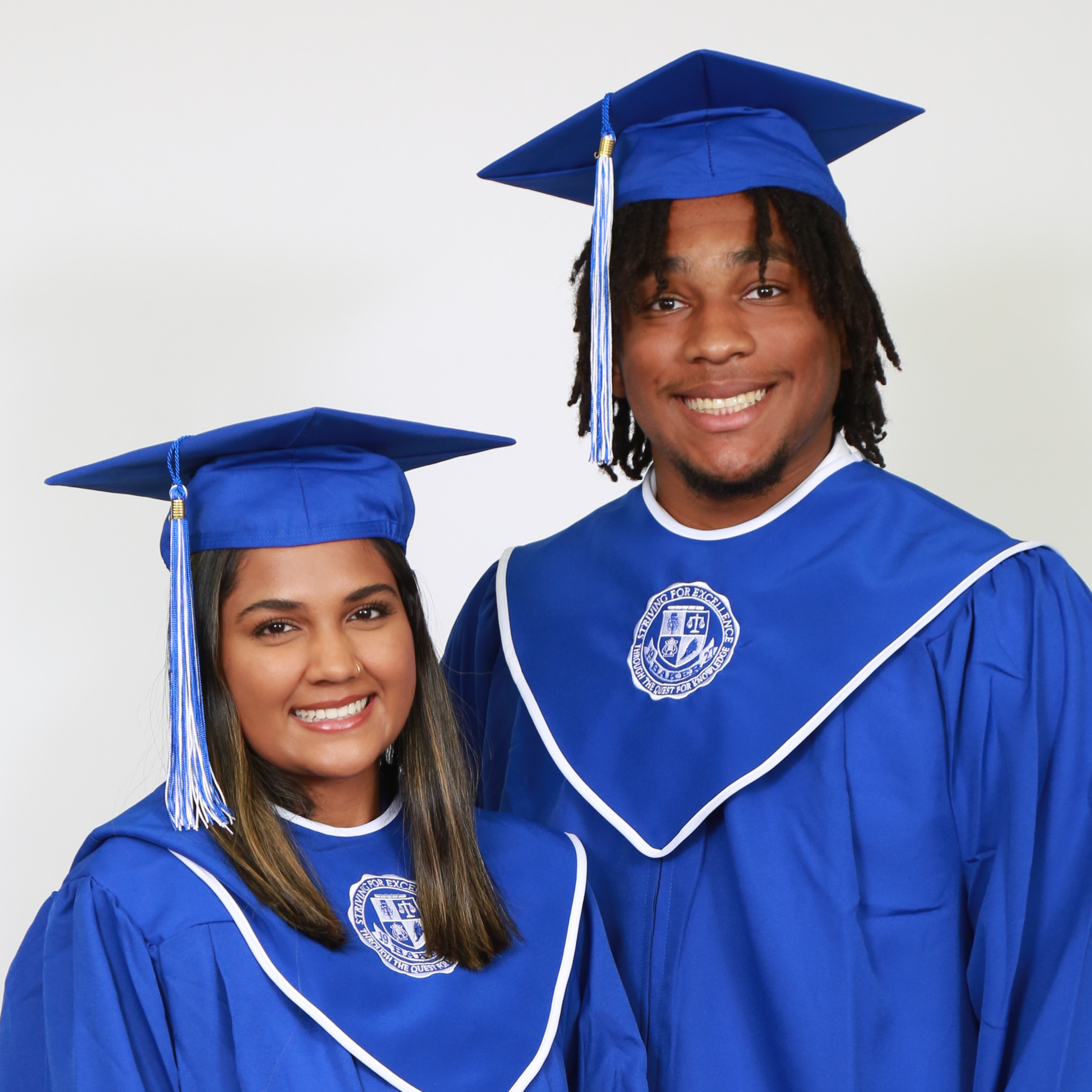 two graduates in cap and gowns