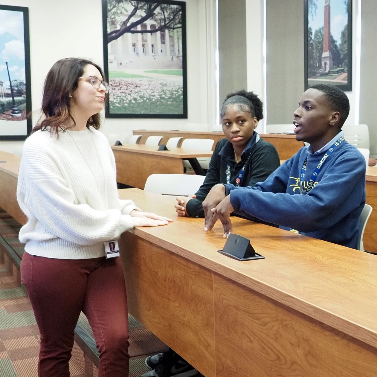 teachers and two students in lecture hall