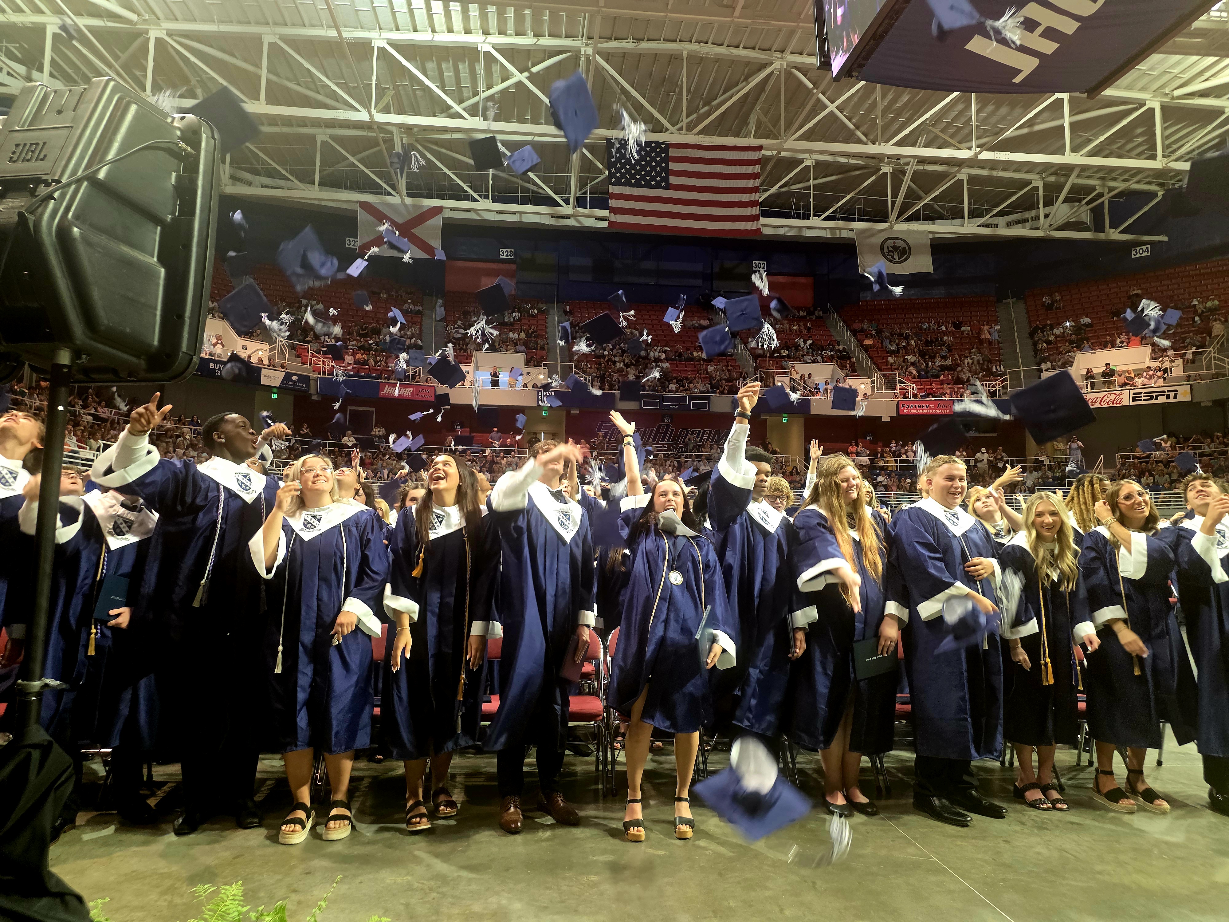 Bryant graduates tossing caps