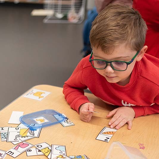 Student playing a matching game