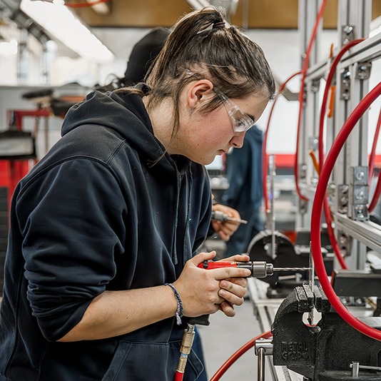 Student drilling in Advanced Manufacturing class