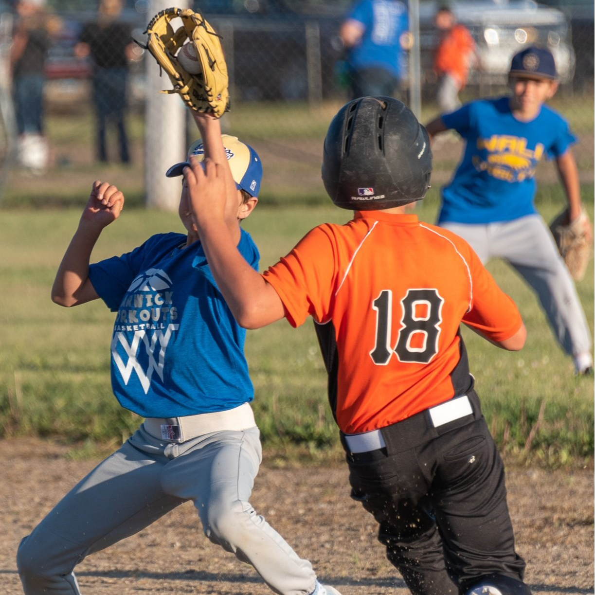 A young boy dressed in a baseball uniform, ready to play, showcasing his enthusiasm for the sport.