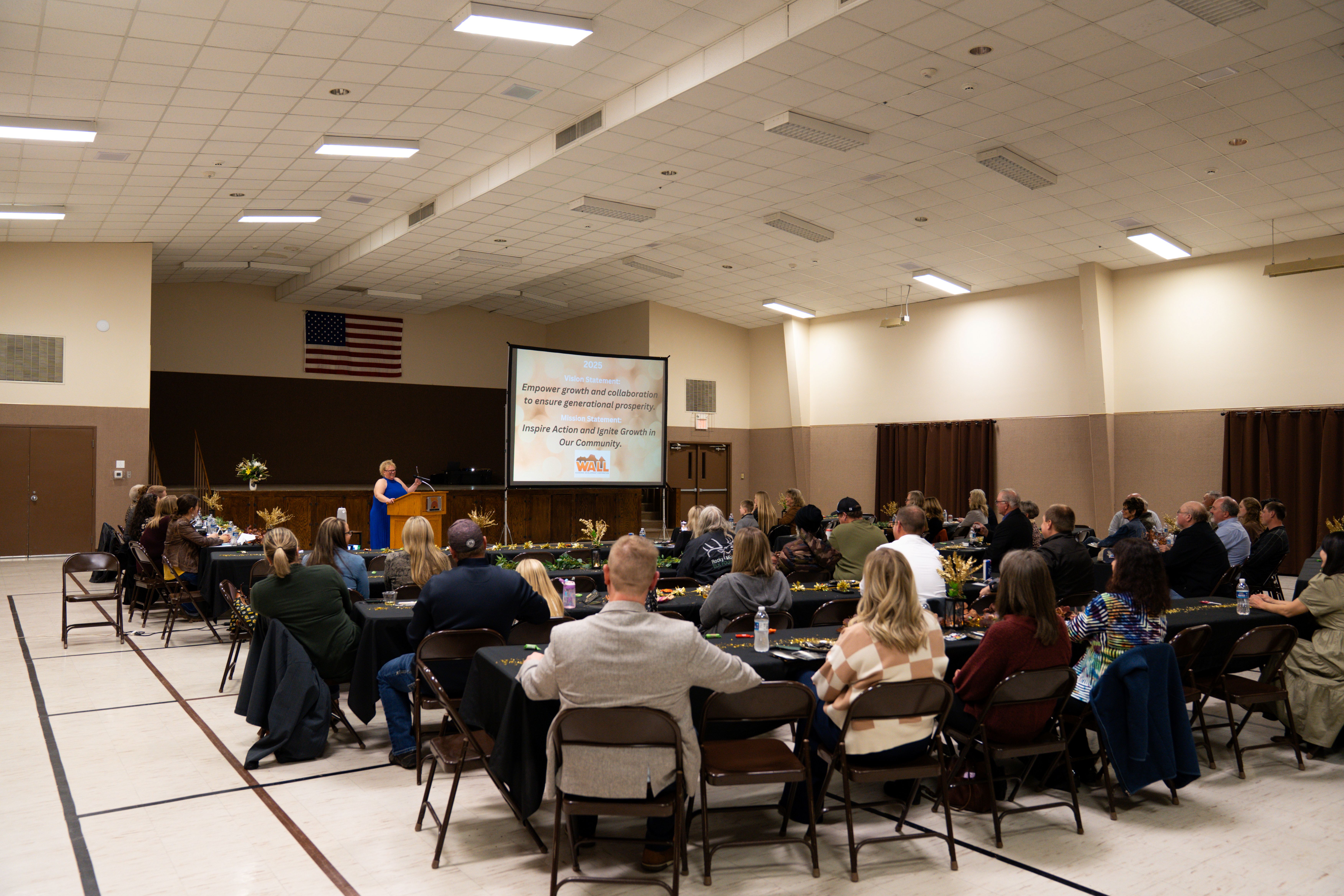 Wall Grand hall WEDC annual meeting looking at stage and speaker