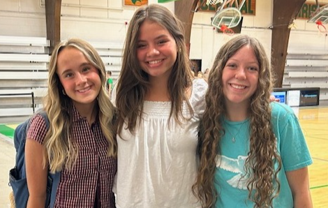 Three girls smilling together