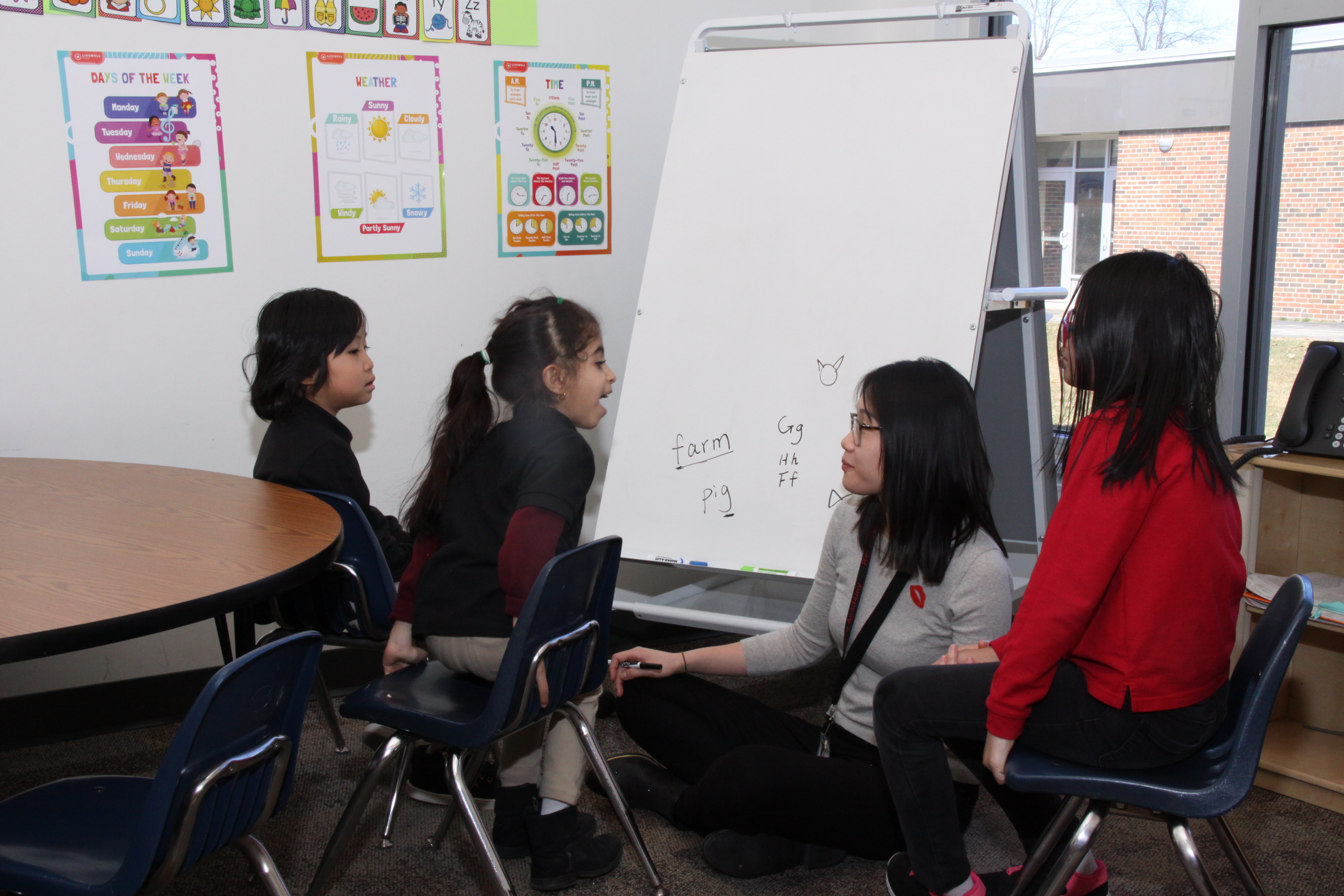 A photo of some students with their teacher.