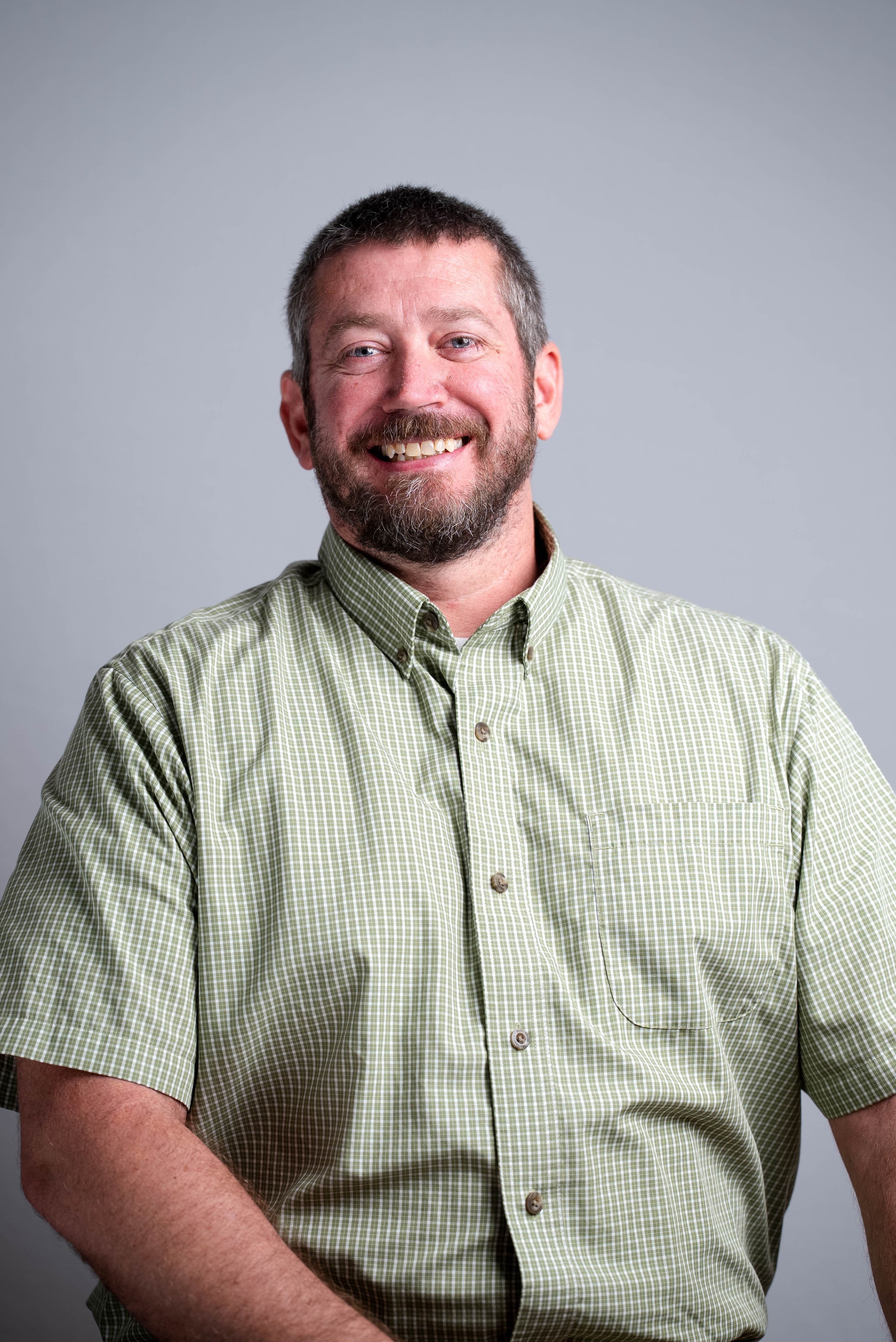 male in green and white shirt