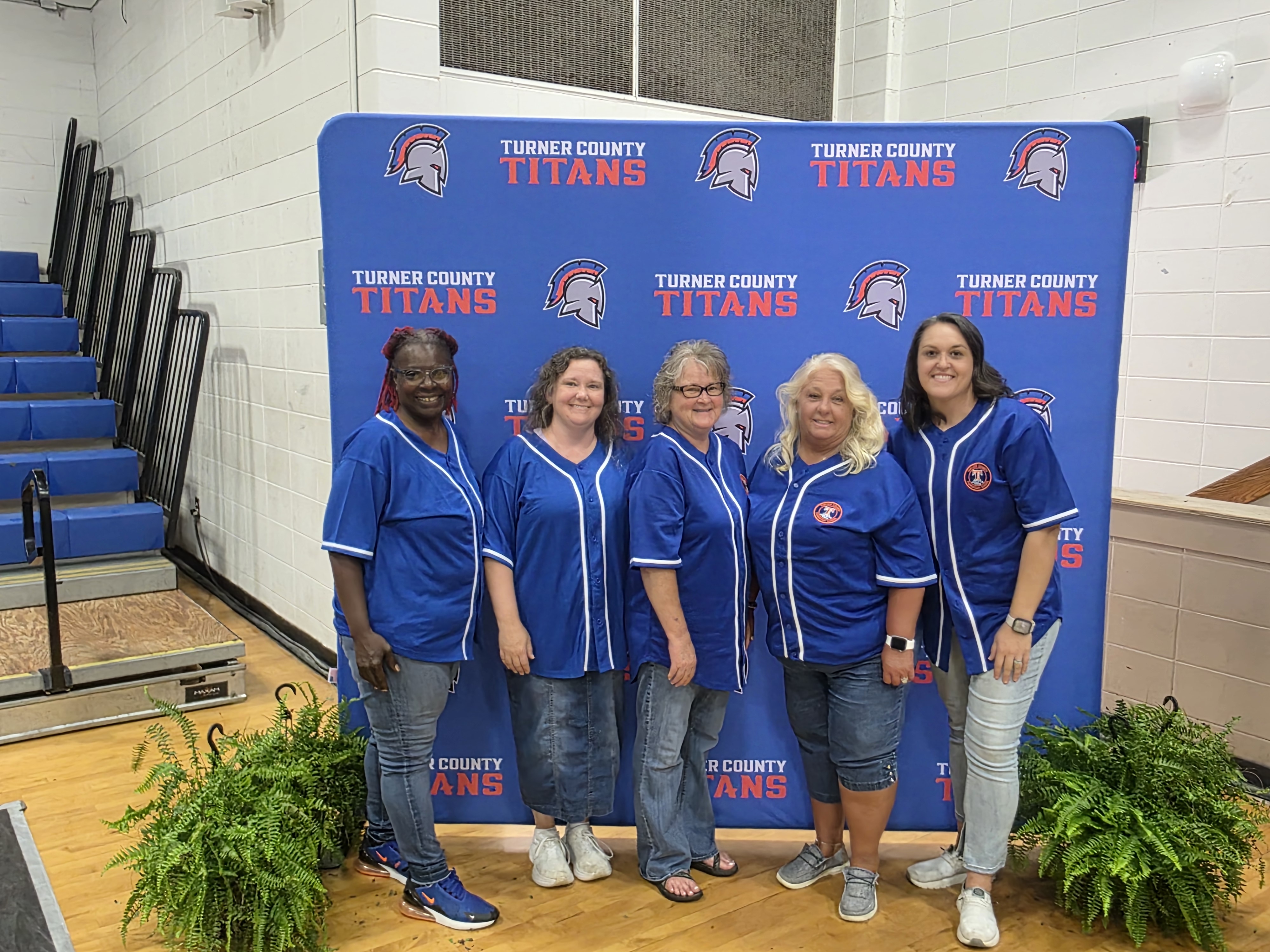 adults, blue with logo backdrop