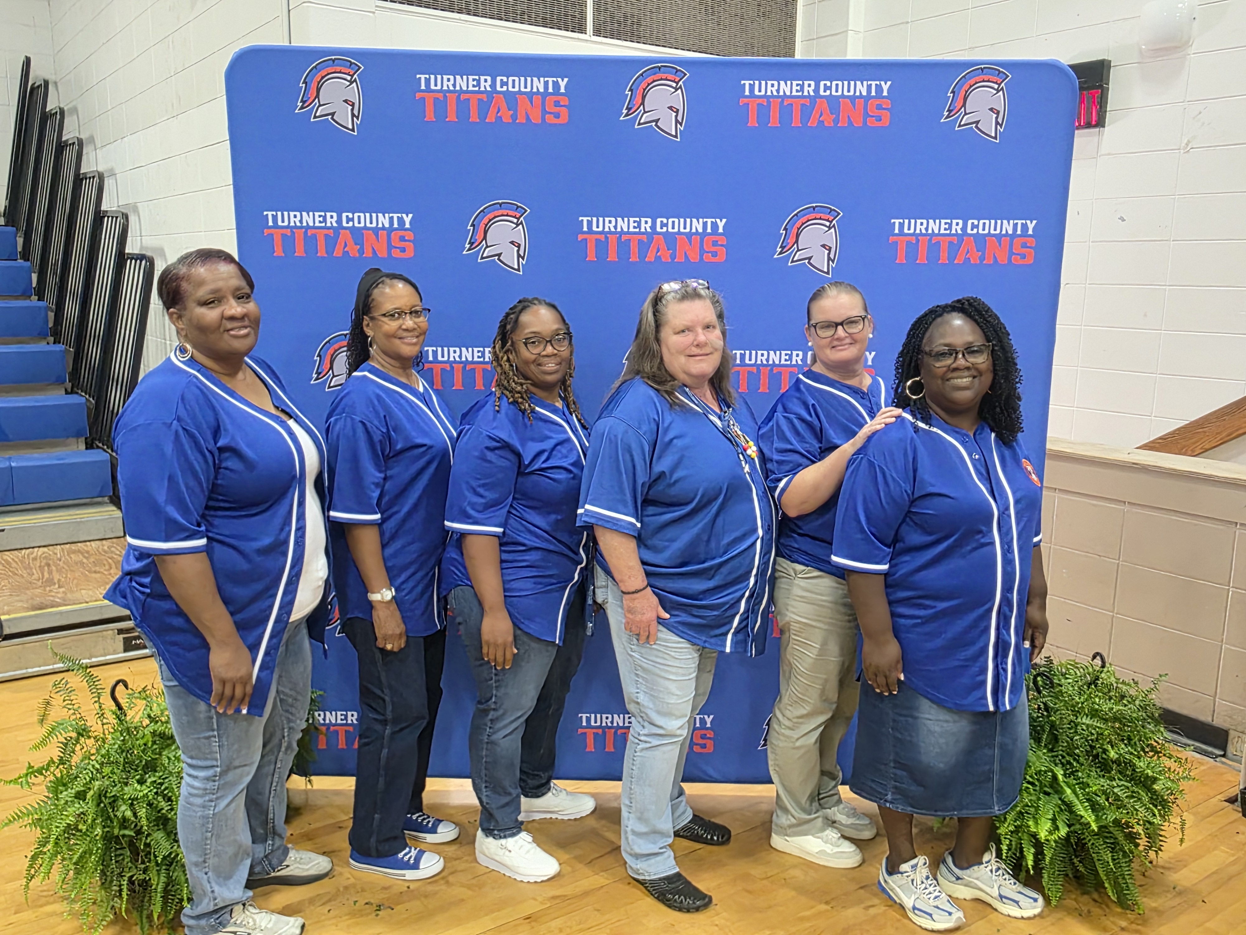 adults, blue with logo backdrop