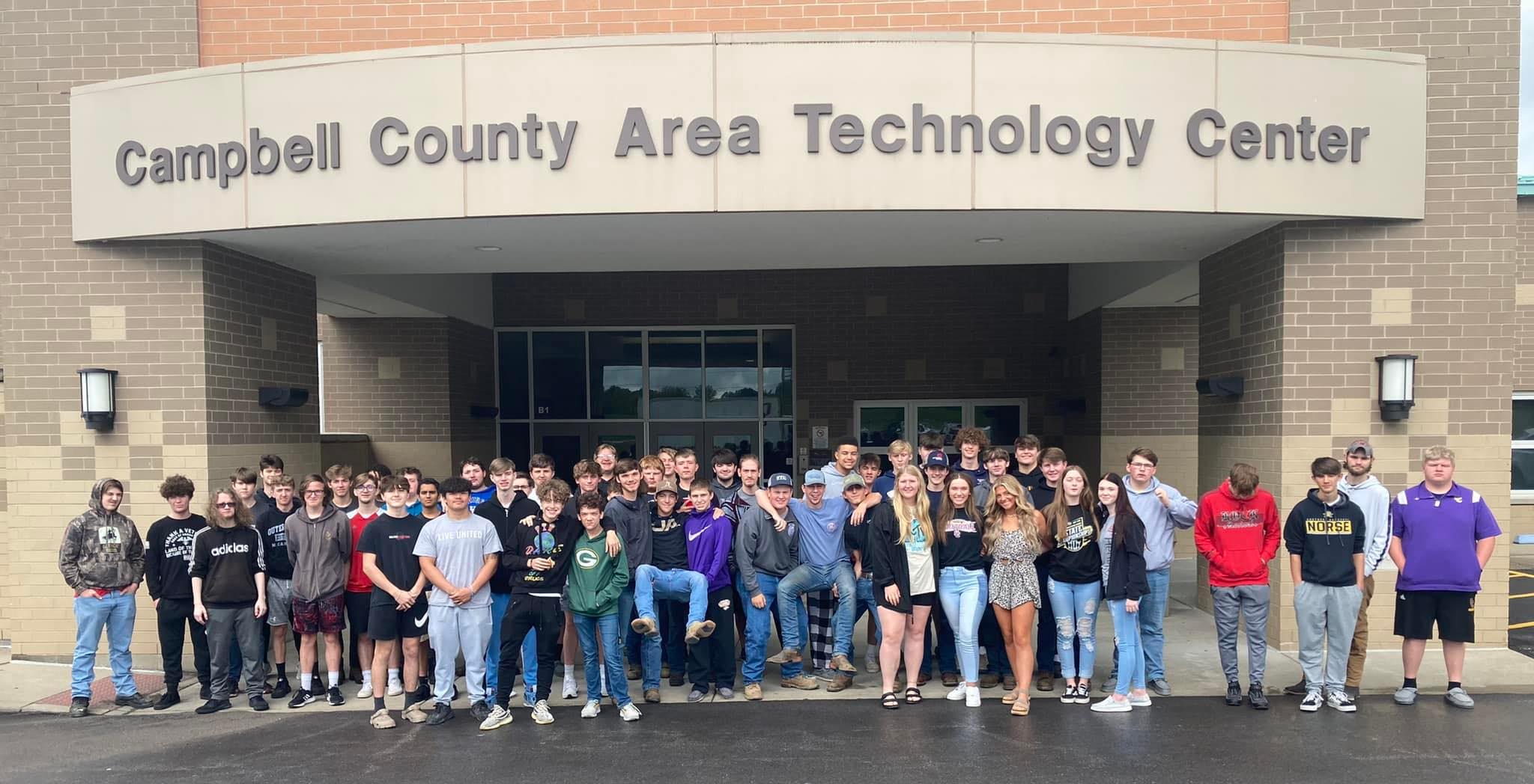students smiling in front of campbell county area tech center