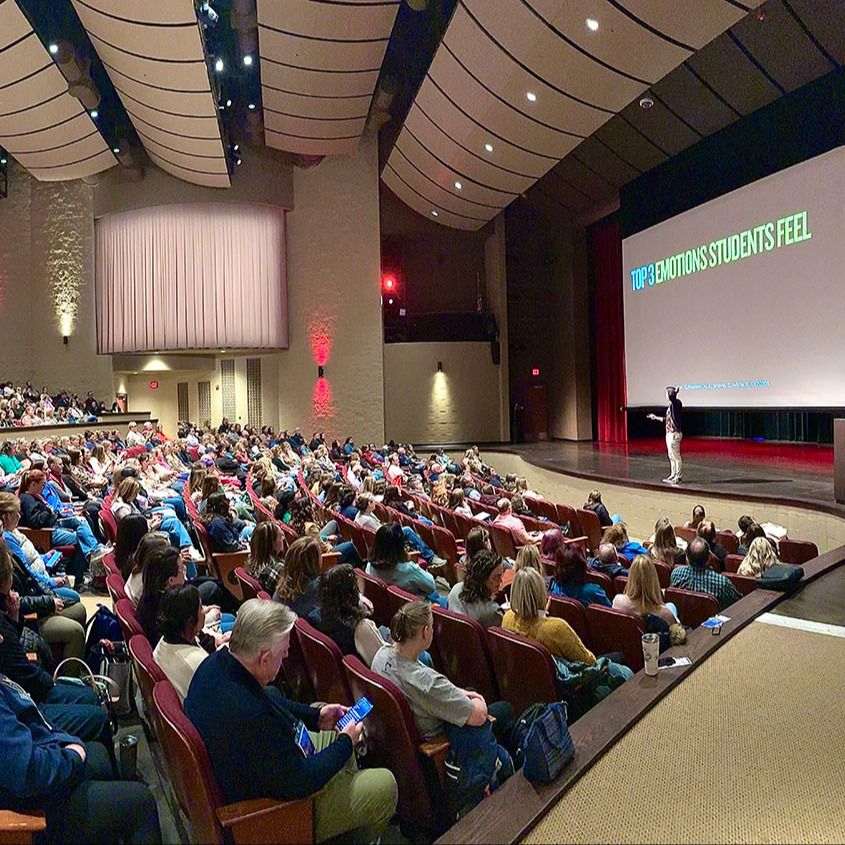 An auditorium full of people at the countywide PD day Educate. Inform. Inspire at Port Huron High School
