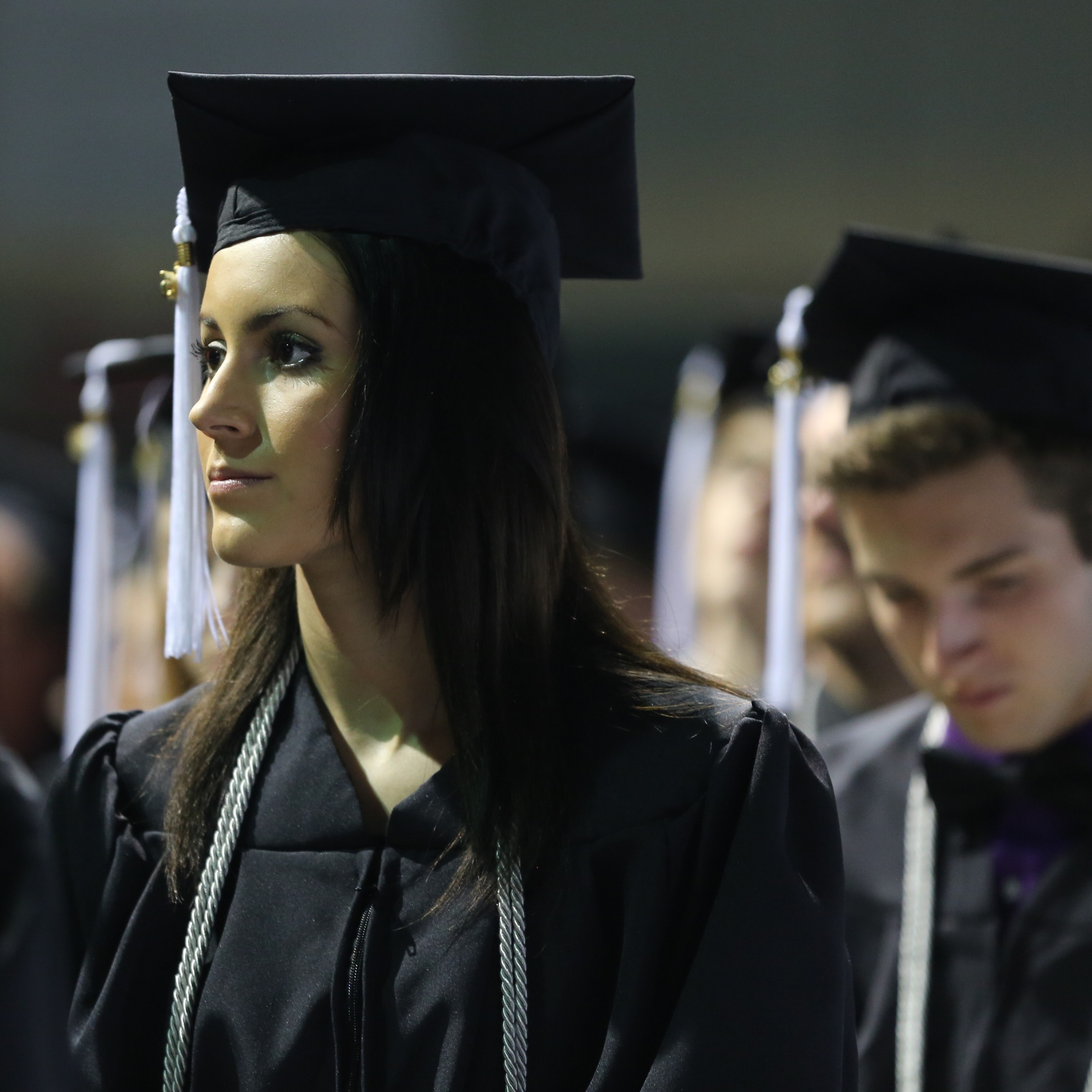 A graduate wearing a cap and gown
