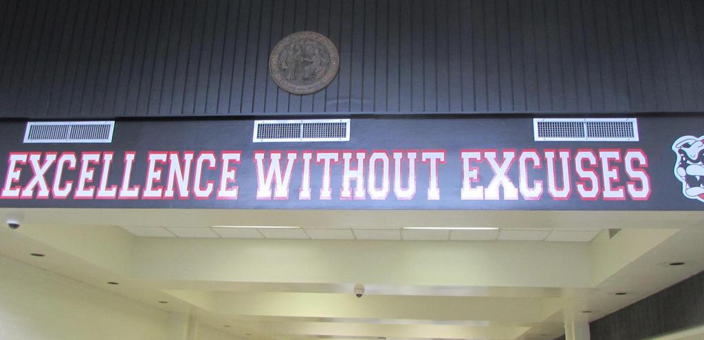 A sign positioned centrally in a hallway, guiding visitors with clear directions and information.