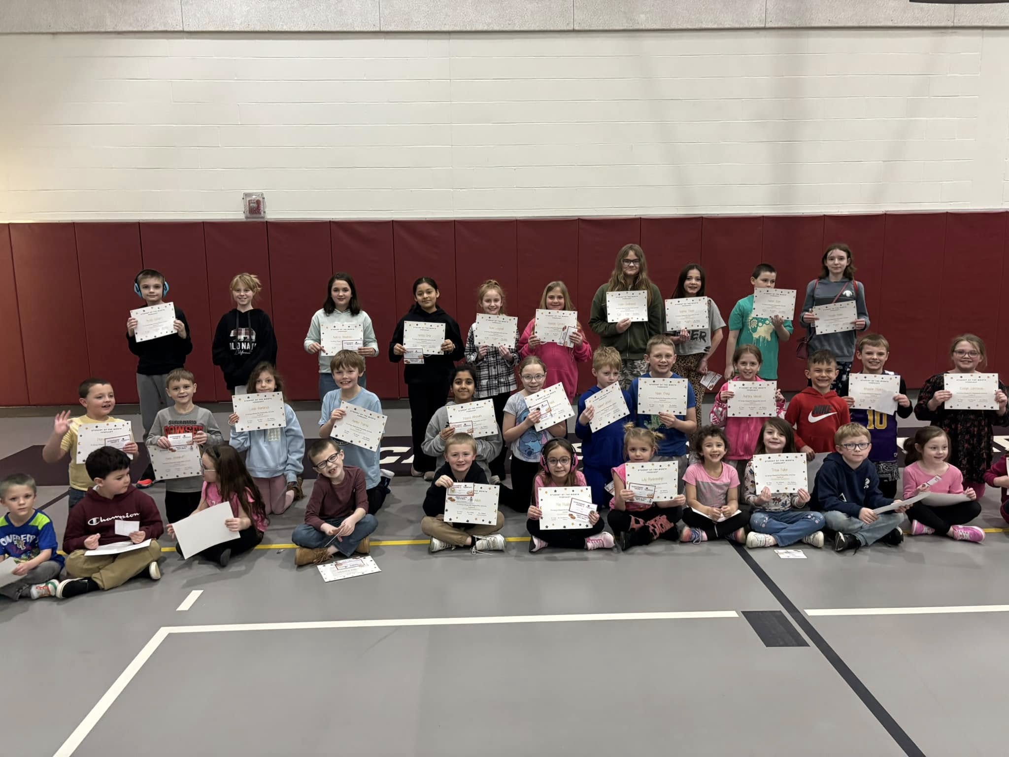 students smiling with their awards