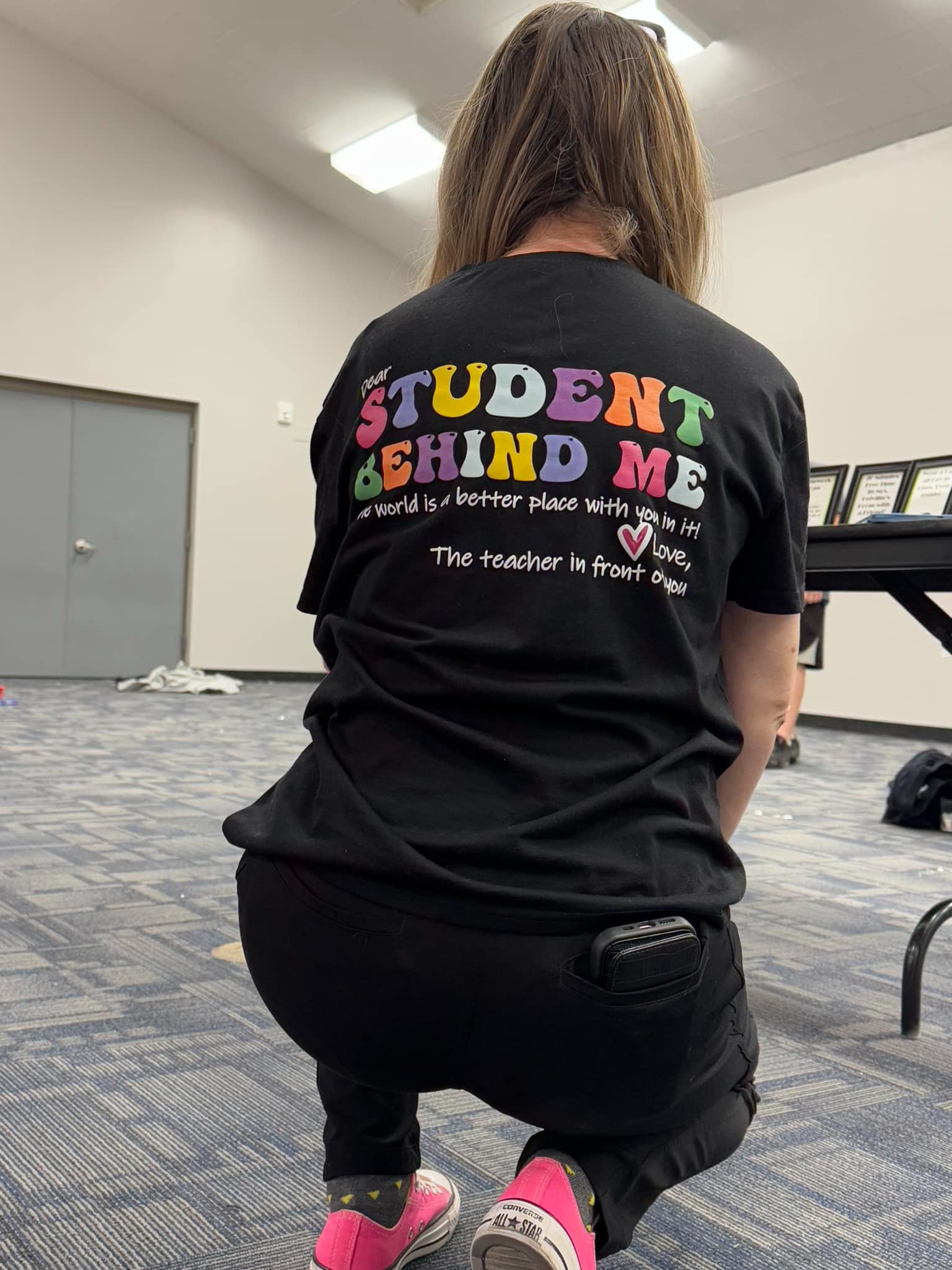 Picture of the back of a teacher's shirt with a loving message