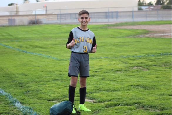 Student wearing his soccer uniform