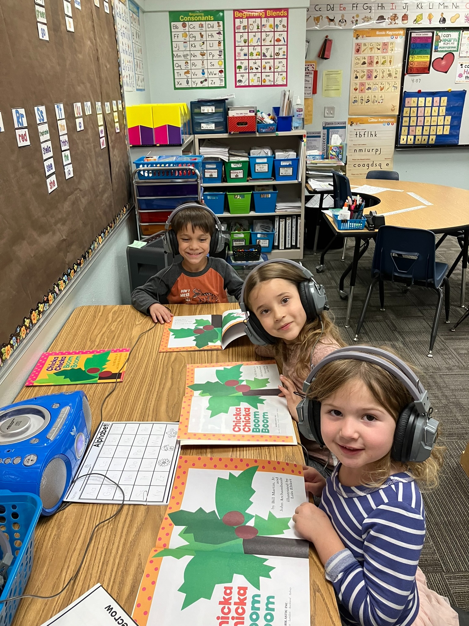 Kinder students reading Chicka Chicka Boom Boom