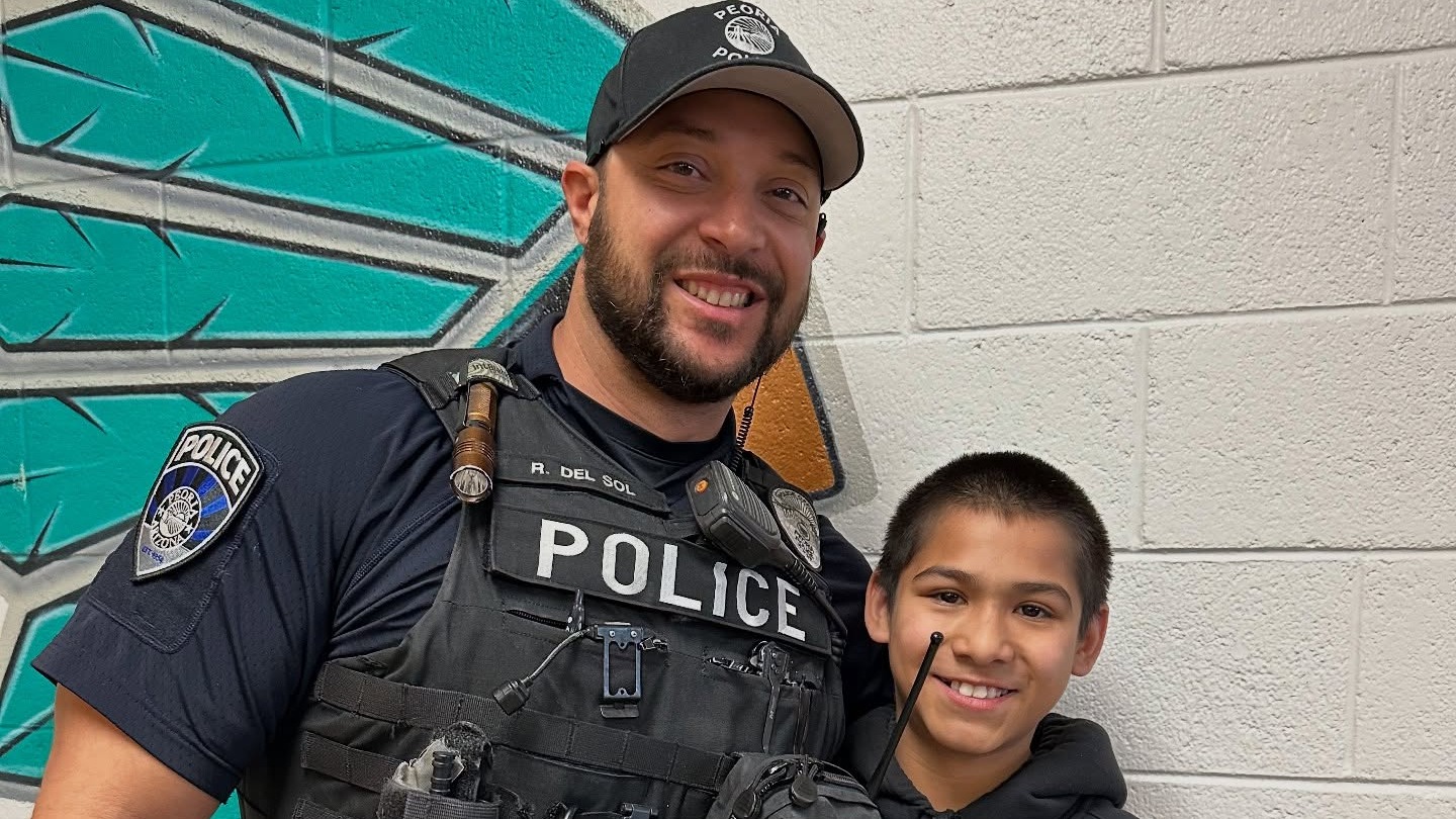 SLO posing with a student