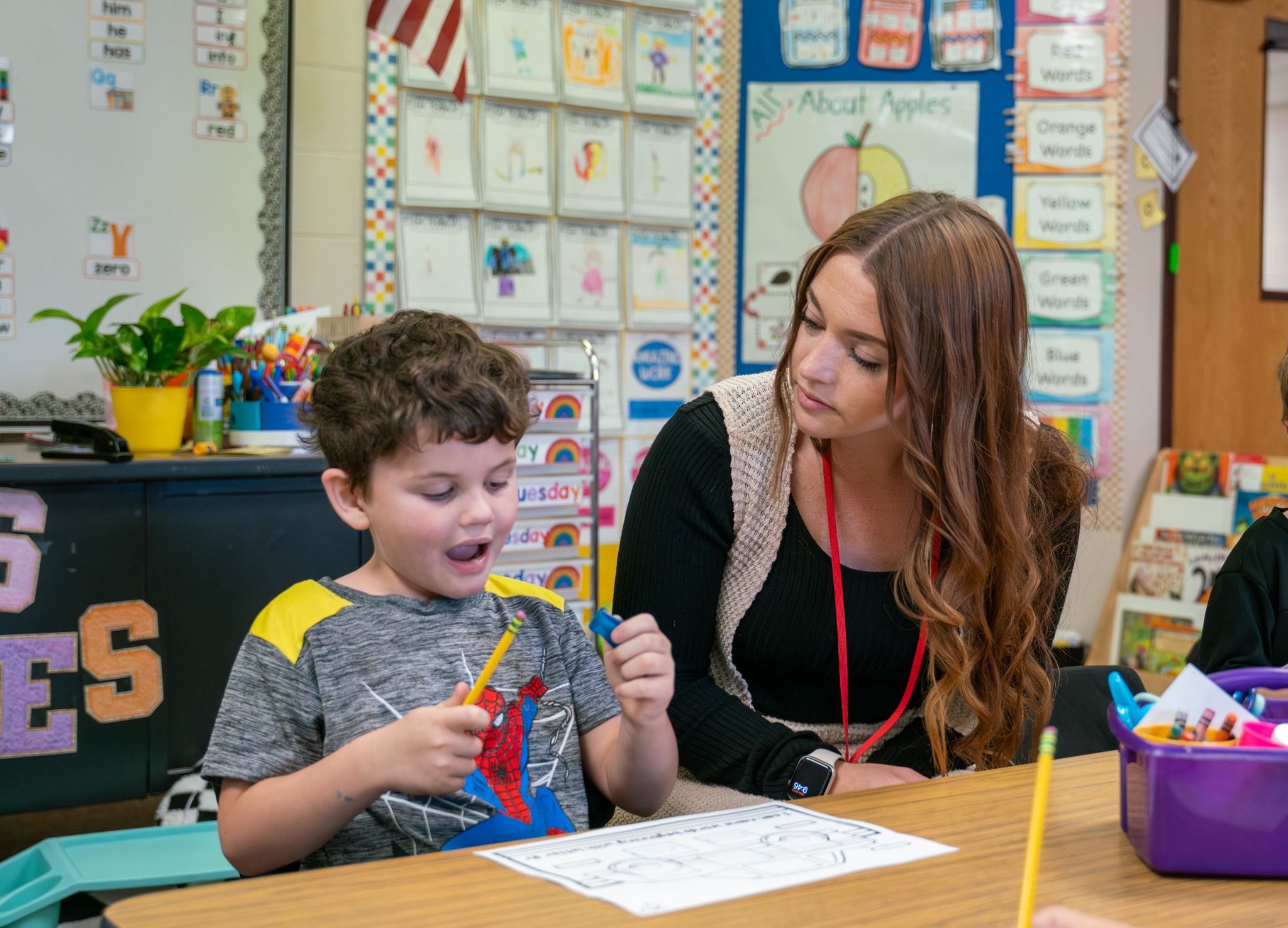 Instructional assistant working with student