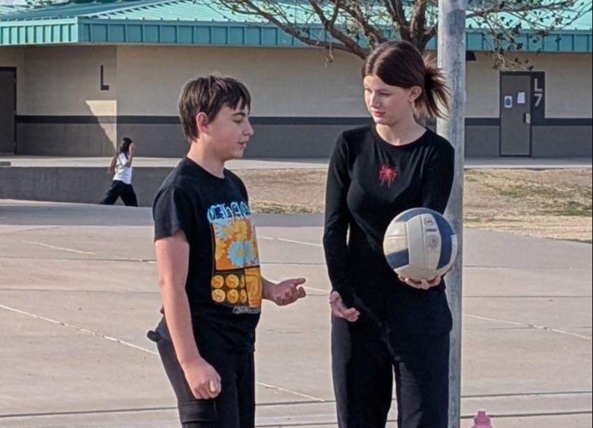 students playing volleyball