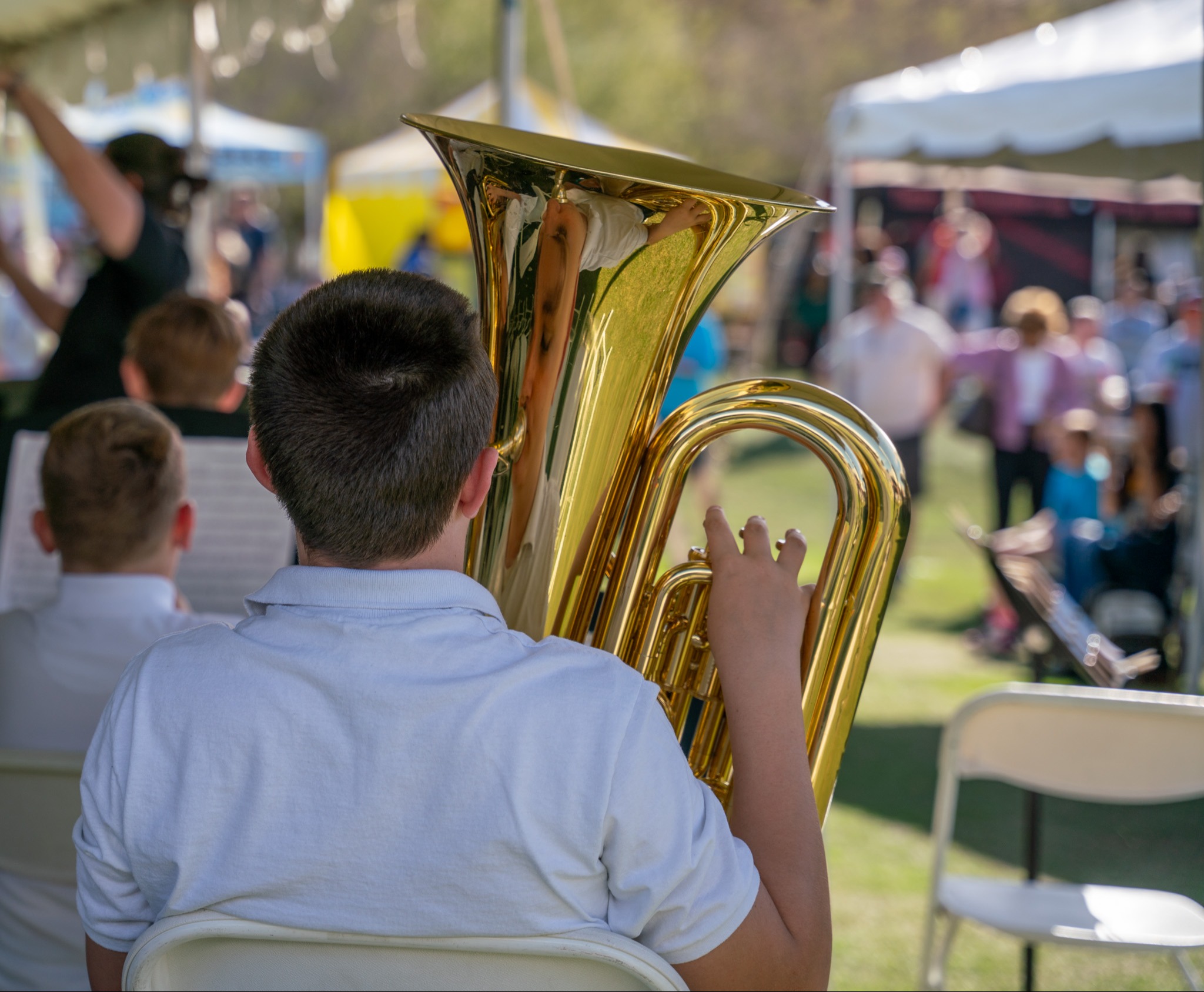 student playing low brass