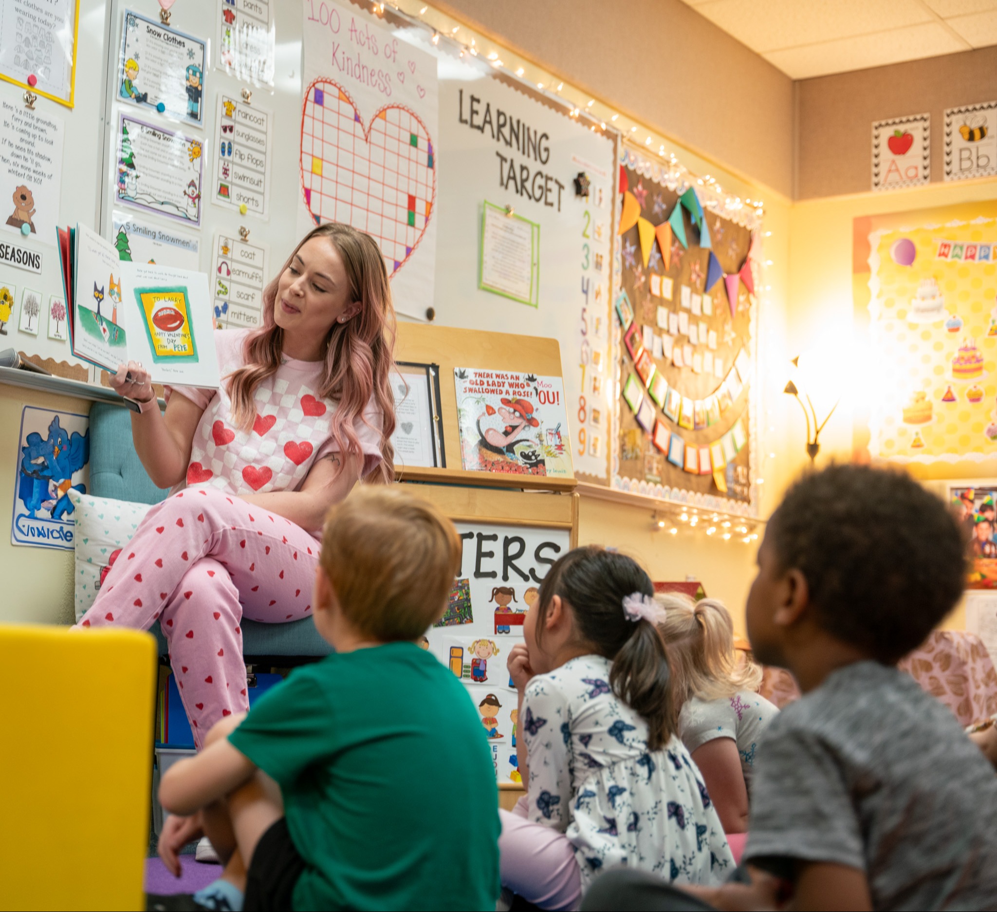 preschool teacher reading to students