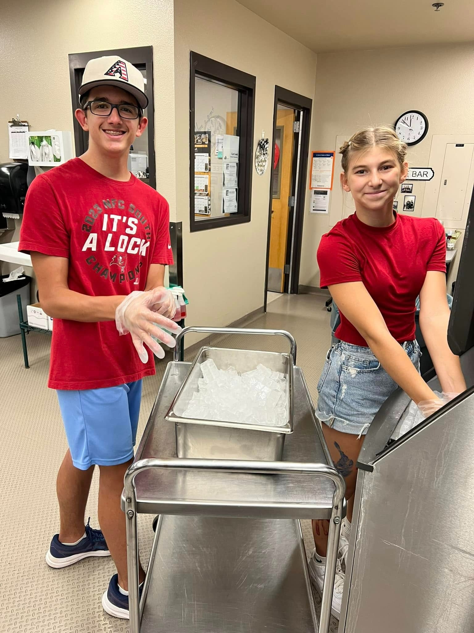 Students smiling while getting ice
