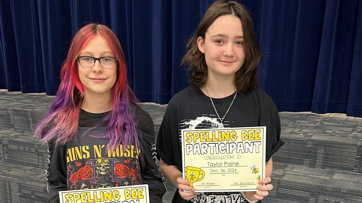 Two students who were Spelling Bee champions