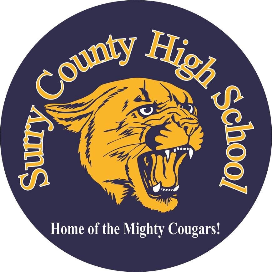 A circular logo featuring a fierce cougar's head in yellow on a dark blue background, with the text 'Surry County High School' and 'Home of the Mighty Cougars!' surrounding it.