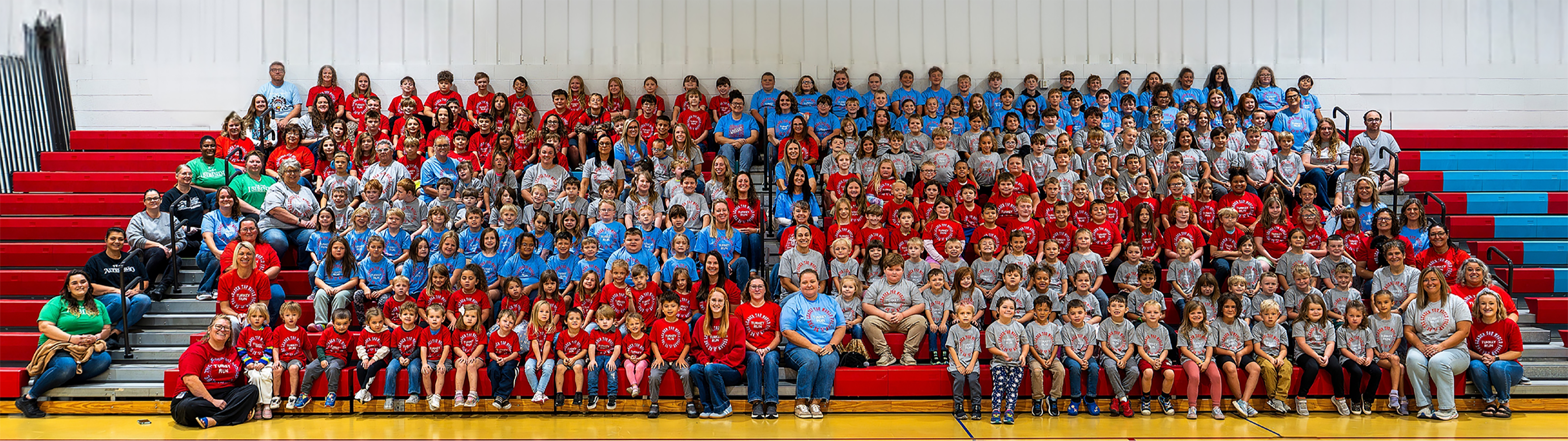 students sitting in the gym