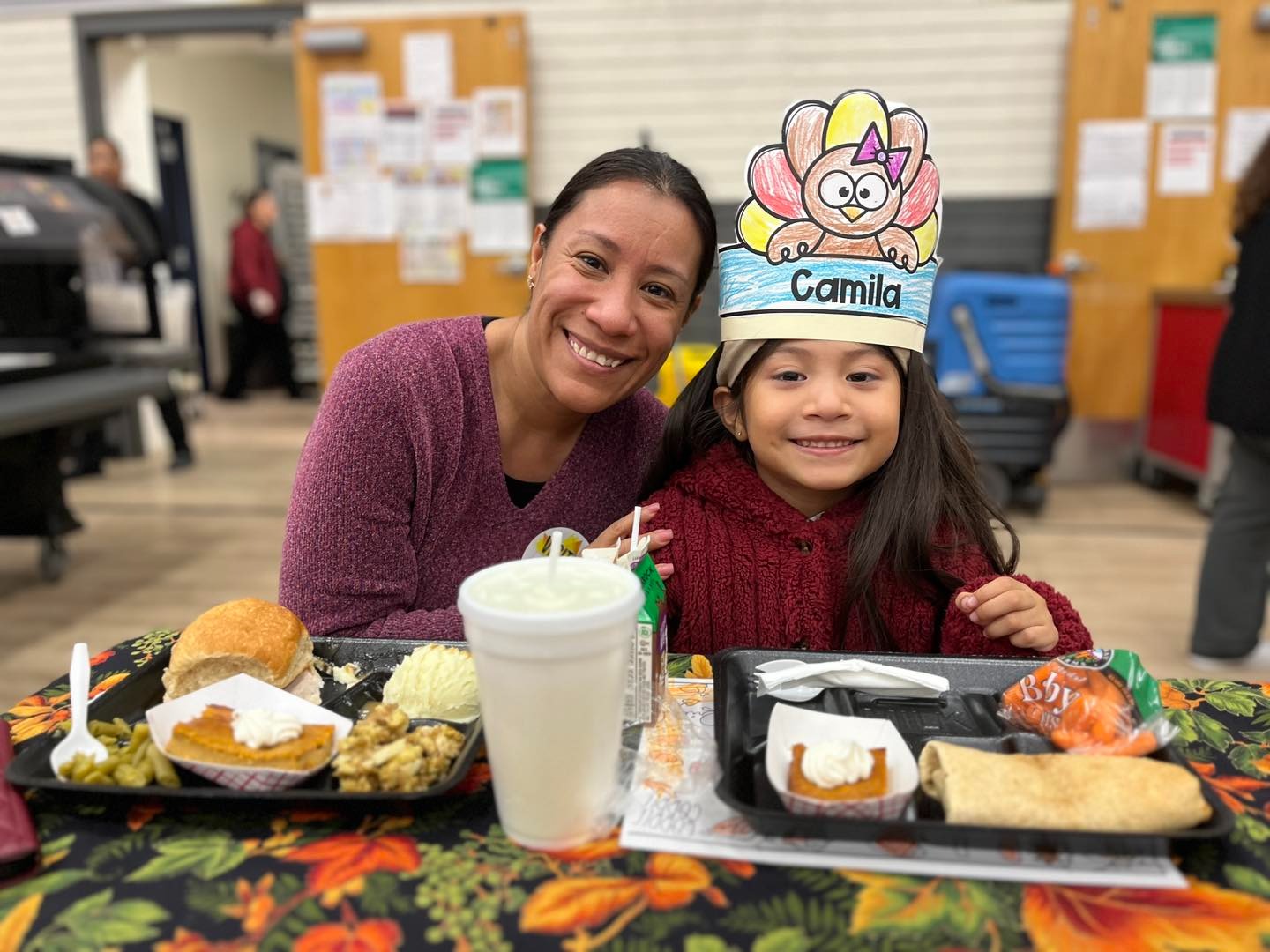 Kindergartener and mom during Thanksgiving meal