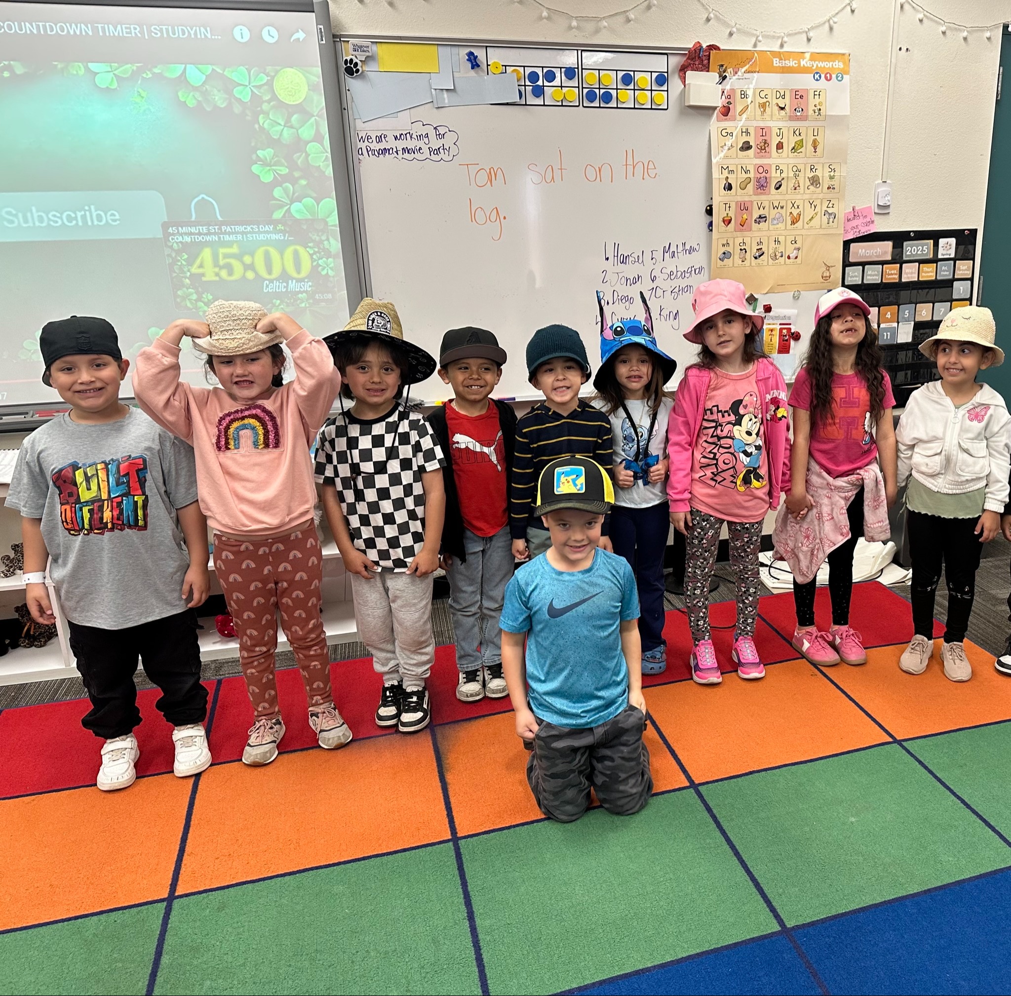Kindergarteners posing in the classroom