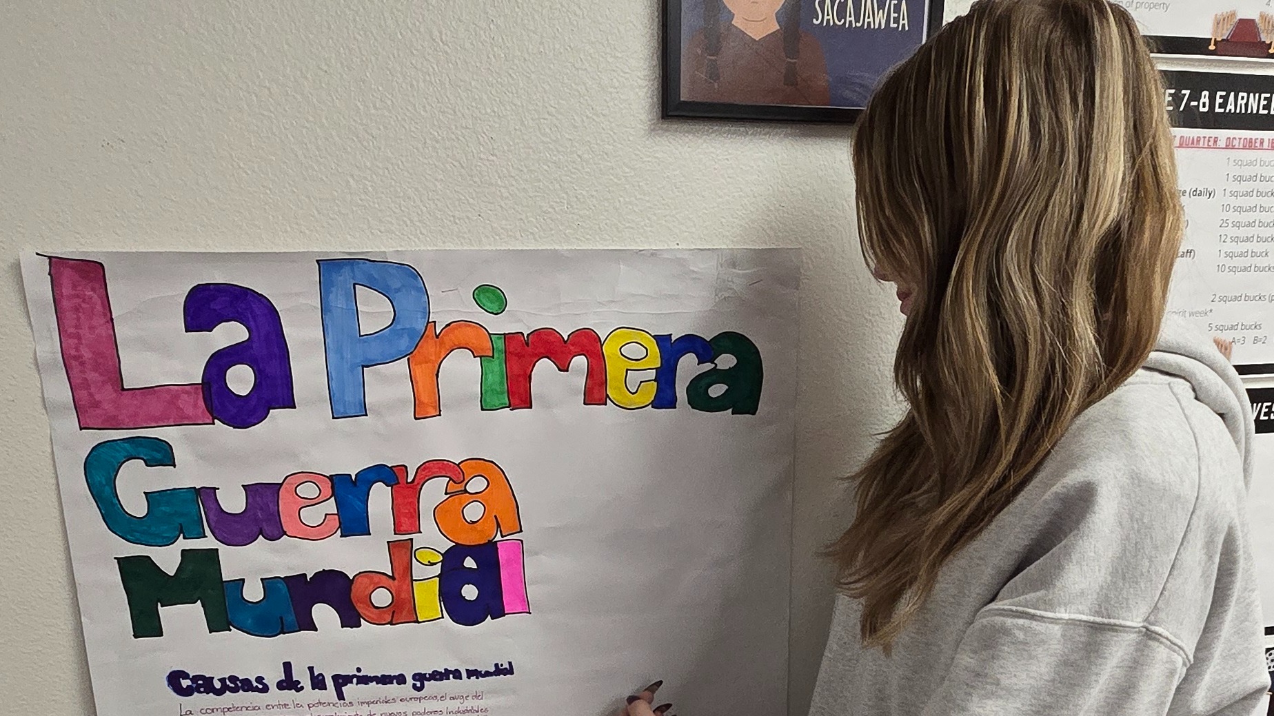 Picture of student working on a poster board
