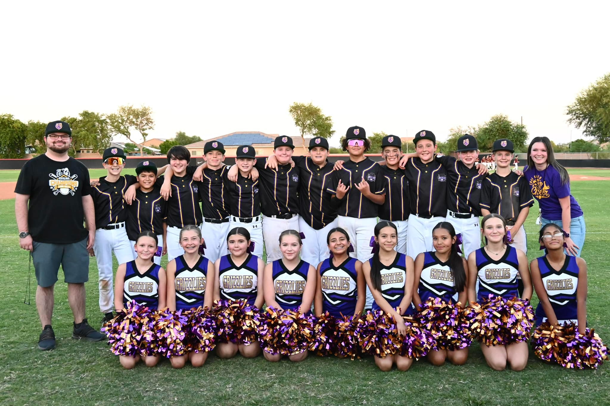 Baseball and cheer team pose for picture
