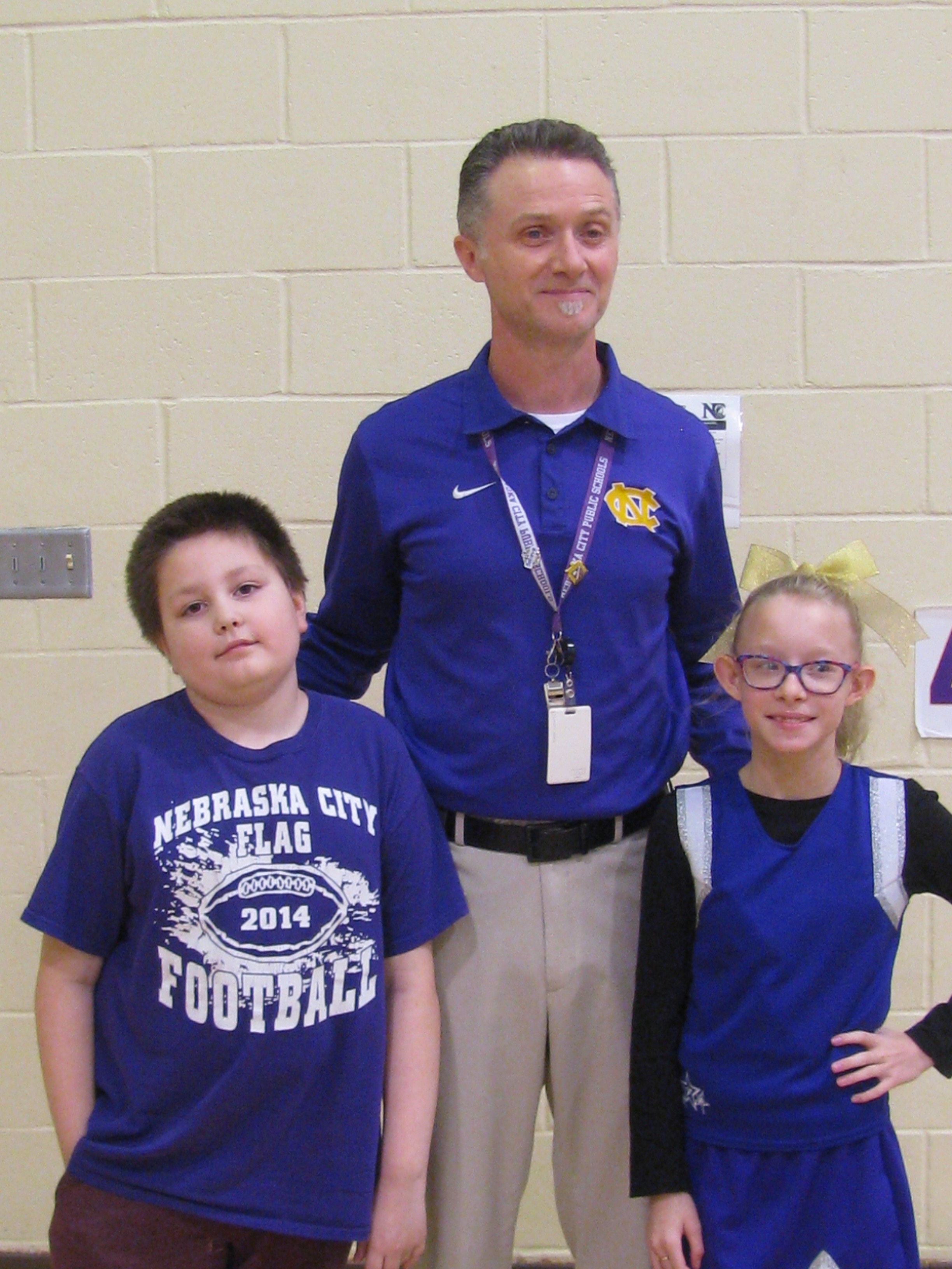 A photo of Zakari, Mr. Davis and Avery.
