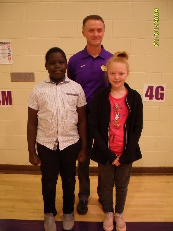 A photo of Miyom, Mr. Davis and Nadine.