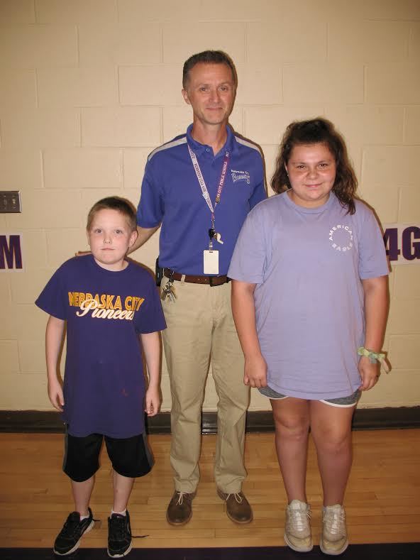 A photo of Zakari, Mr. Davis and Abigal.