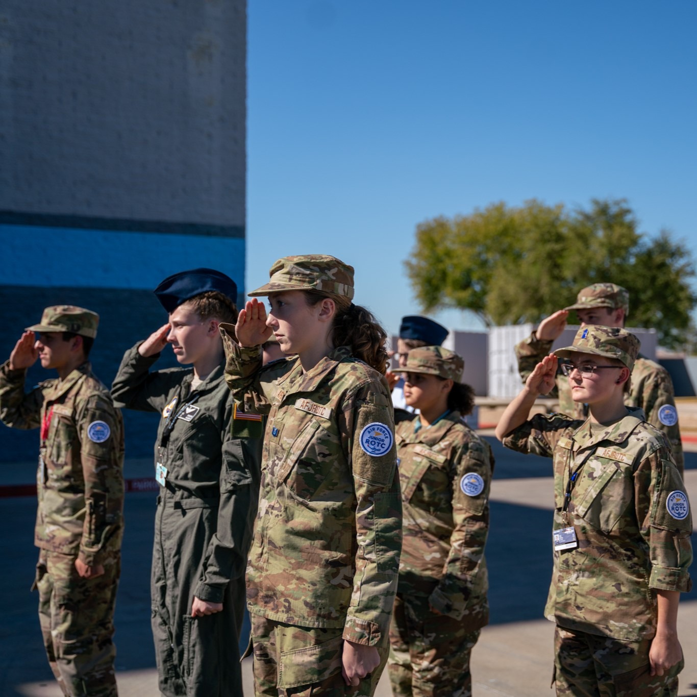 AFJROTC students outside saluting