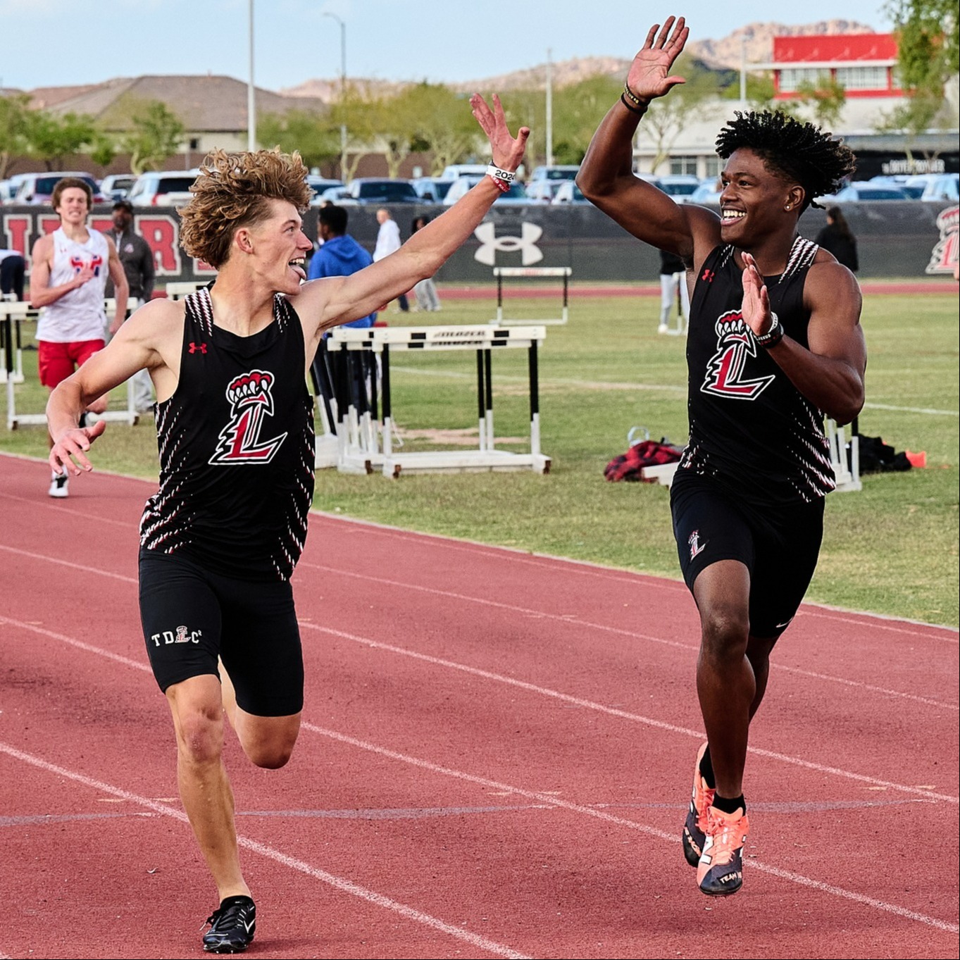 Students high fiving while running